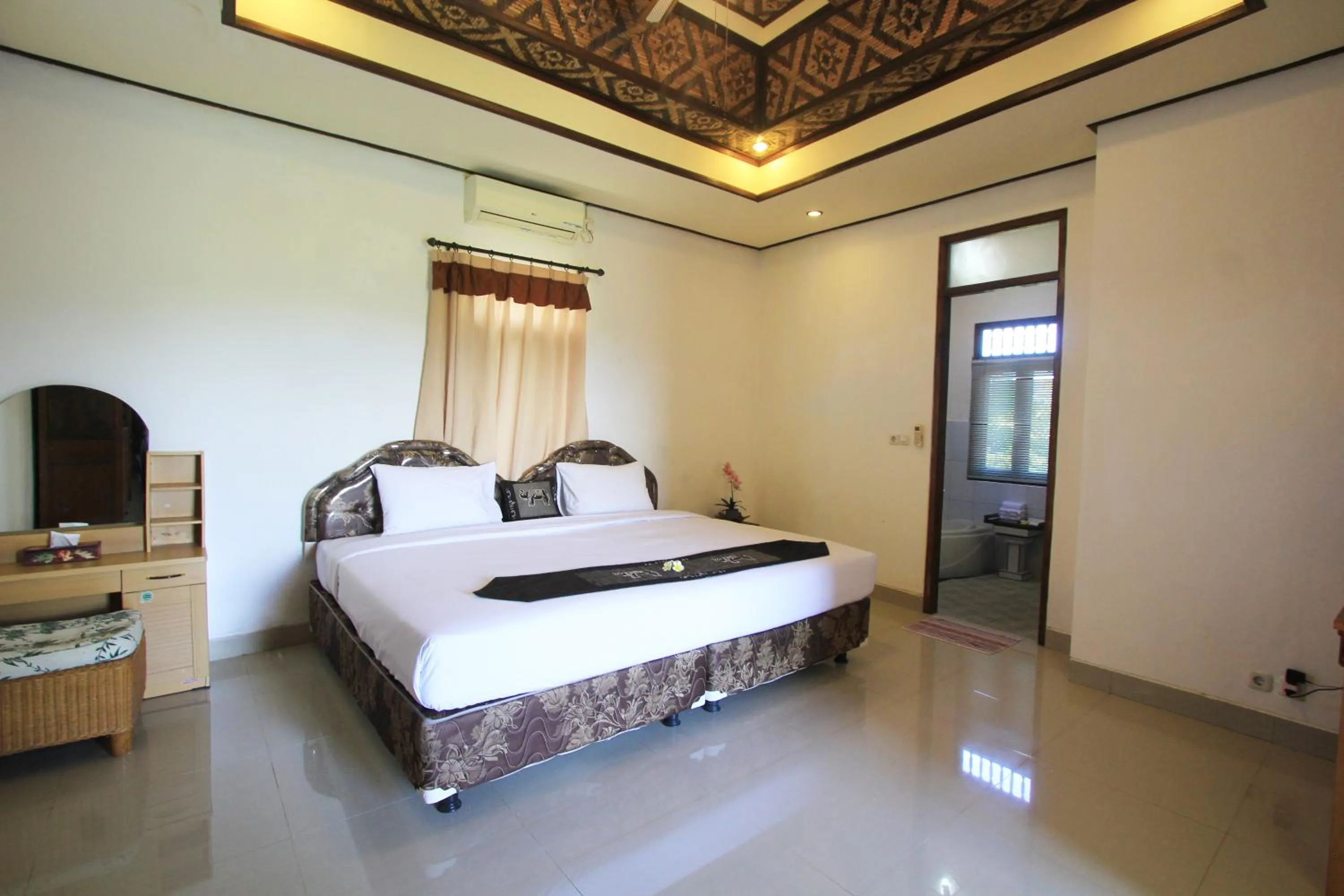 Bed in SUARA SIDHI Villa Ubud Bali