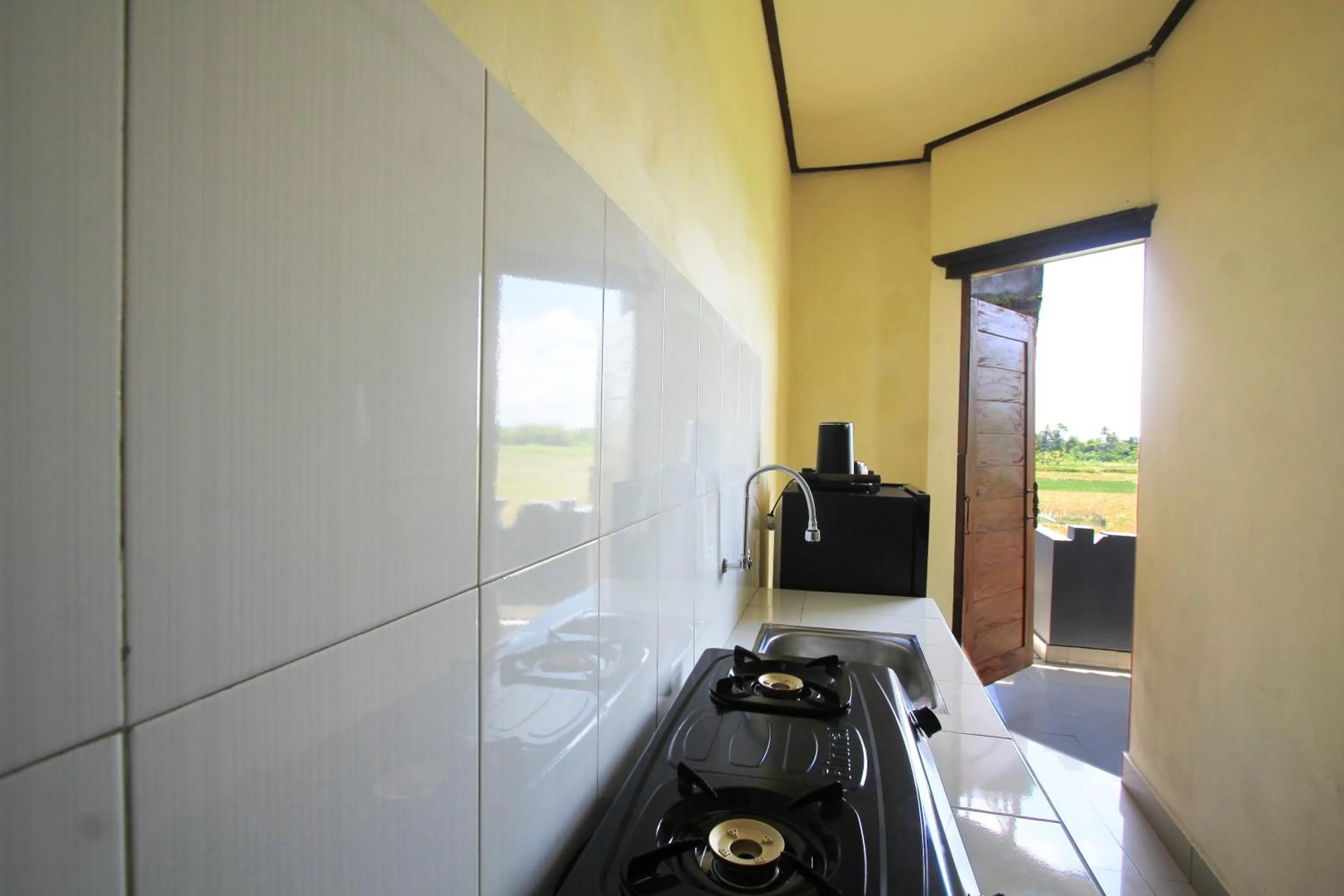 Kitchen or kitchenette in SUARA SIDHI Villa Ubud Bali