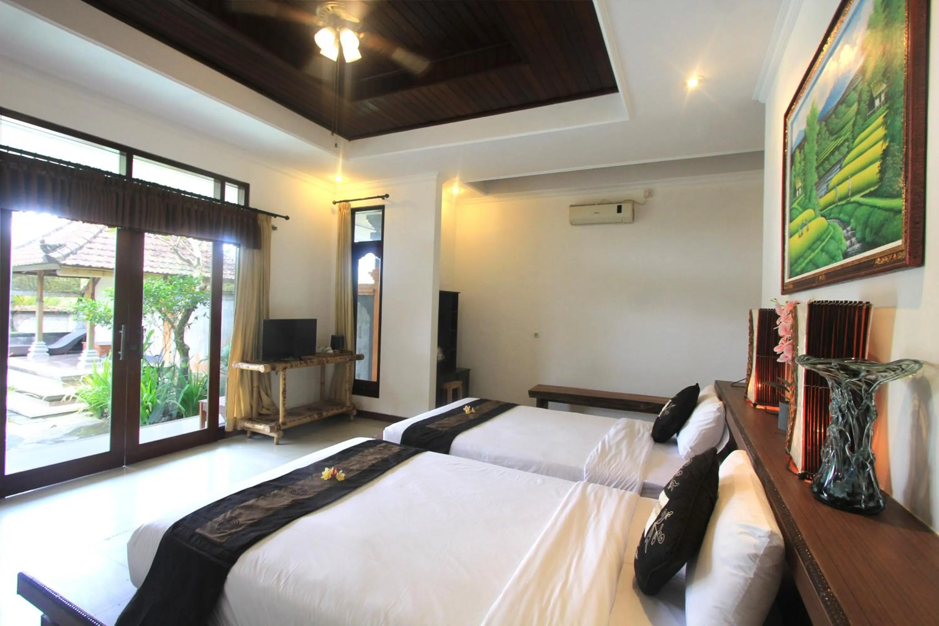 Bed in SUARA SIDHI Villa Ubud Bali