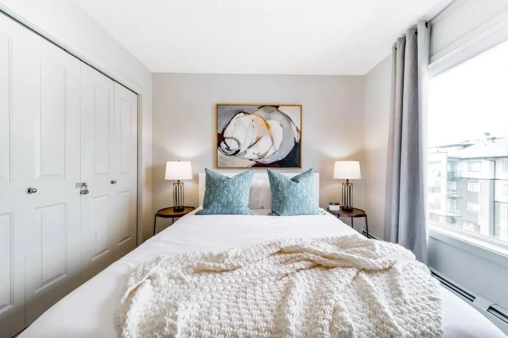 Bed in Bright Luxe Condo, AC, Top Floor, King Bed, Balcony!