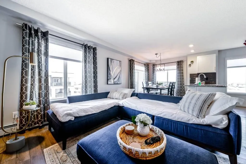 Bed in Bright Luxe Condo, AC, Top Floor, King Bed, Balcony!