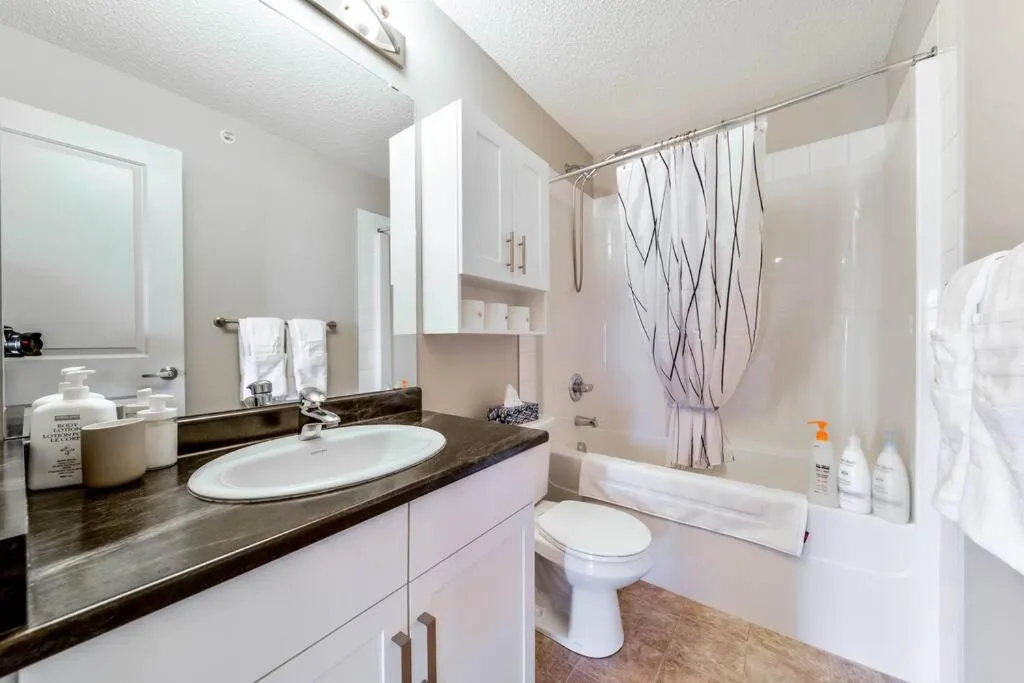 Shower in Bright Luxe Condo, AC, Top Floor, King Bed, Balcony!
