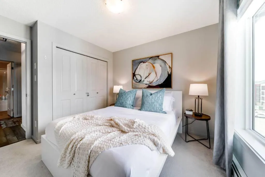 Bed in Bright Luxe Condo, AC, Top Floor, King Bed, Balcony!