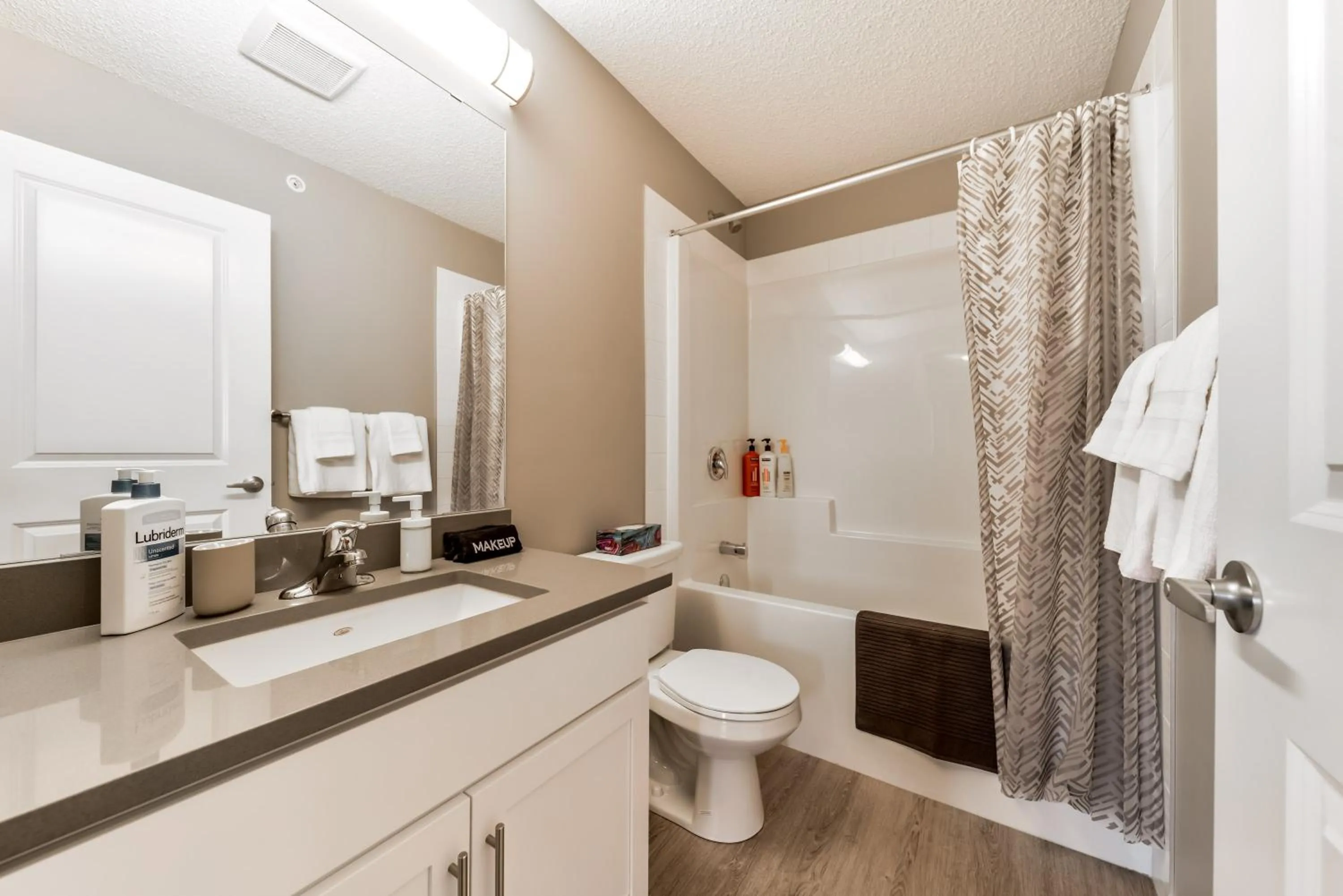 Shower in Peaceful Oasis Condo, AC, Top Floor, Secure UG Parking, Balcony, King Bed!