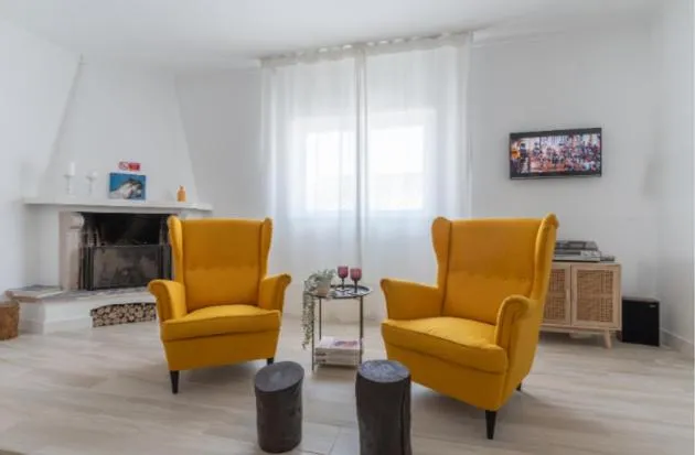 Communal lounge/ TV room in Galagana Charm House