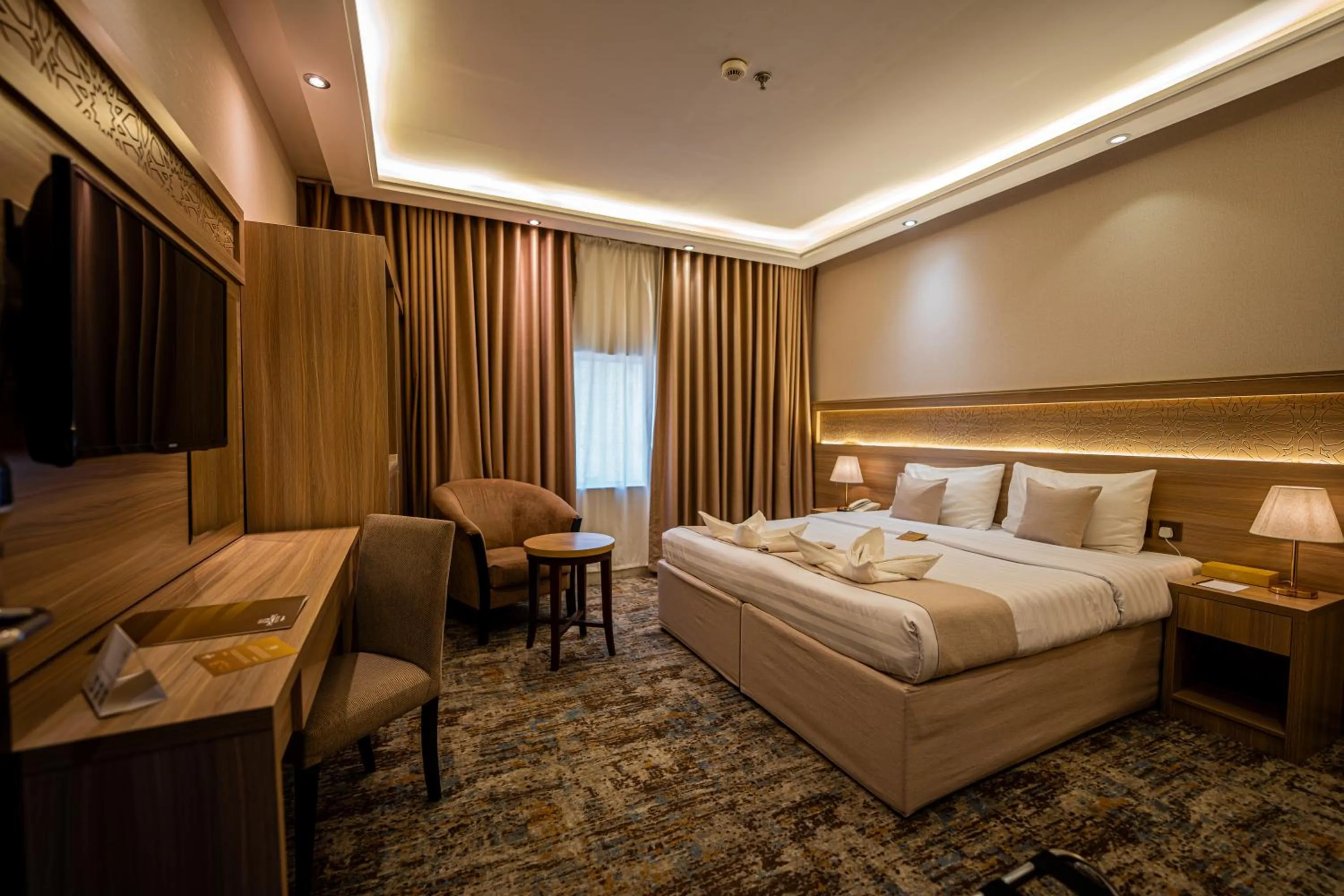 Bed in Snood Al Azama Hotel