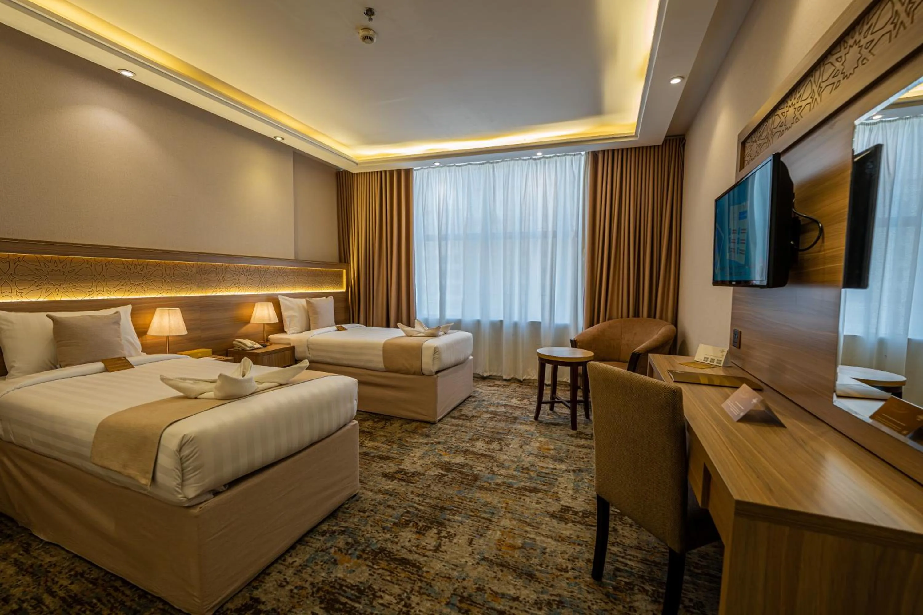 Communal lounge/ TV room, Bed in Snood Al Azama Hotel