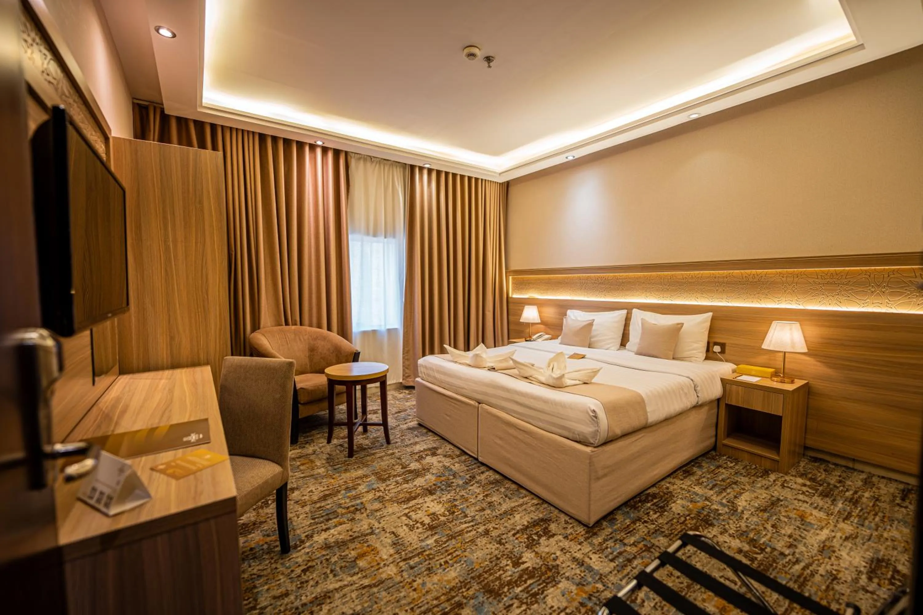 Bed in Snood Al Azama Hotel