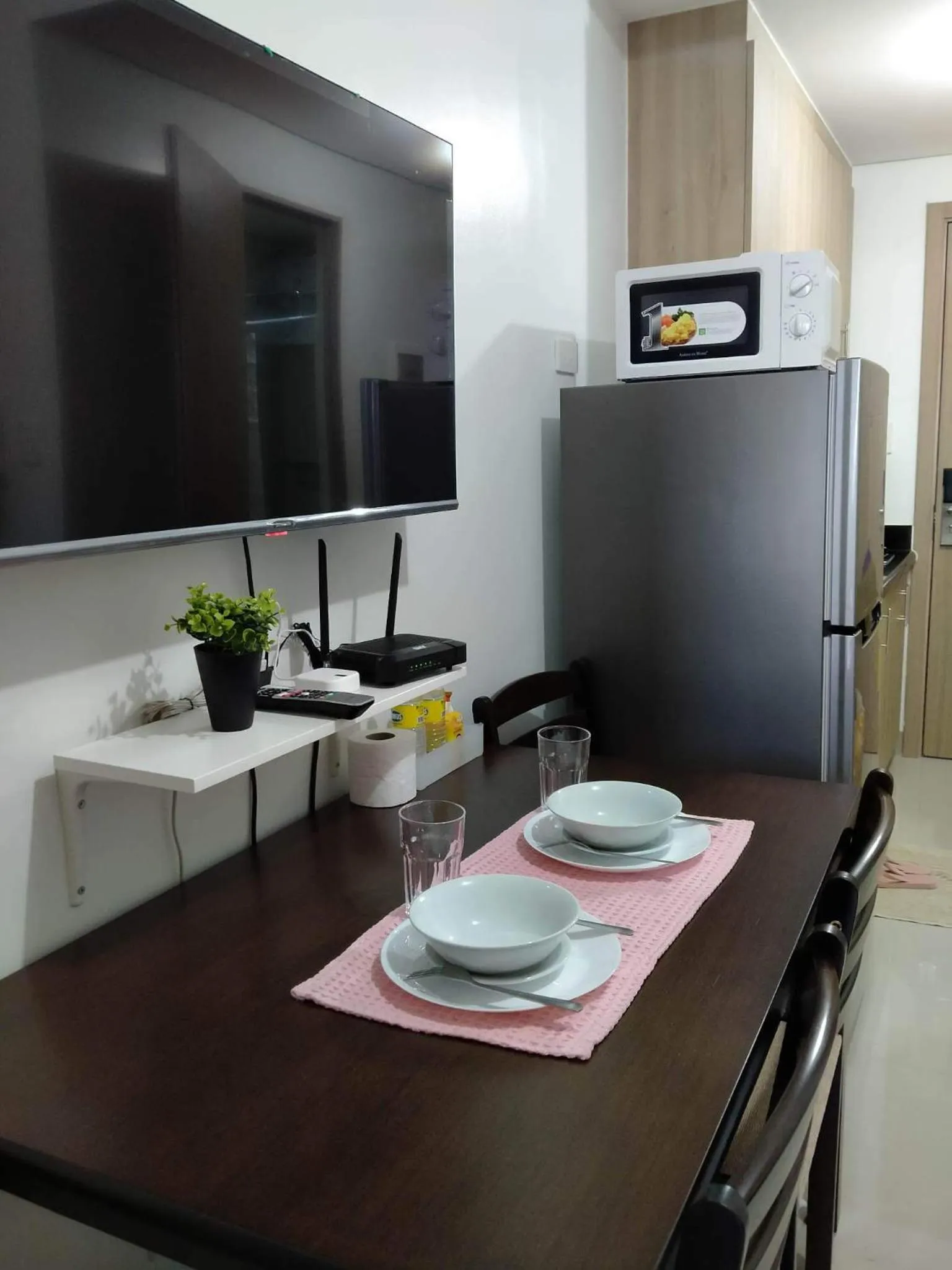 TV and multimedia in Cozy22 1BR at Shore2 Tower2