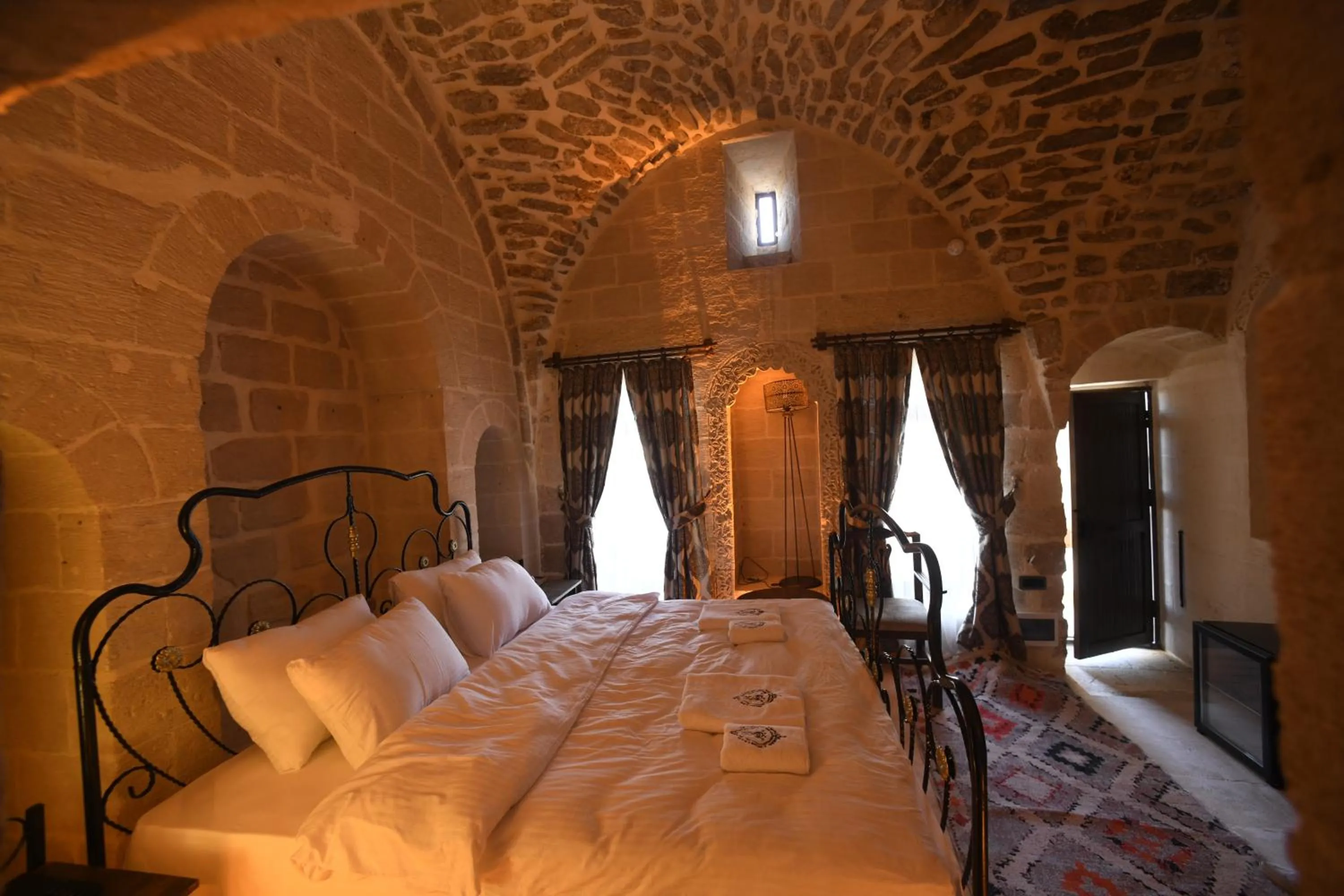 Bed in Legacy Mesopotamia Hotel