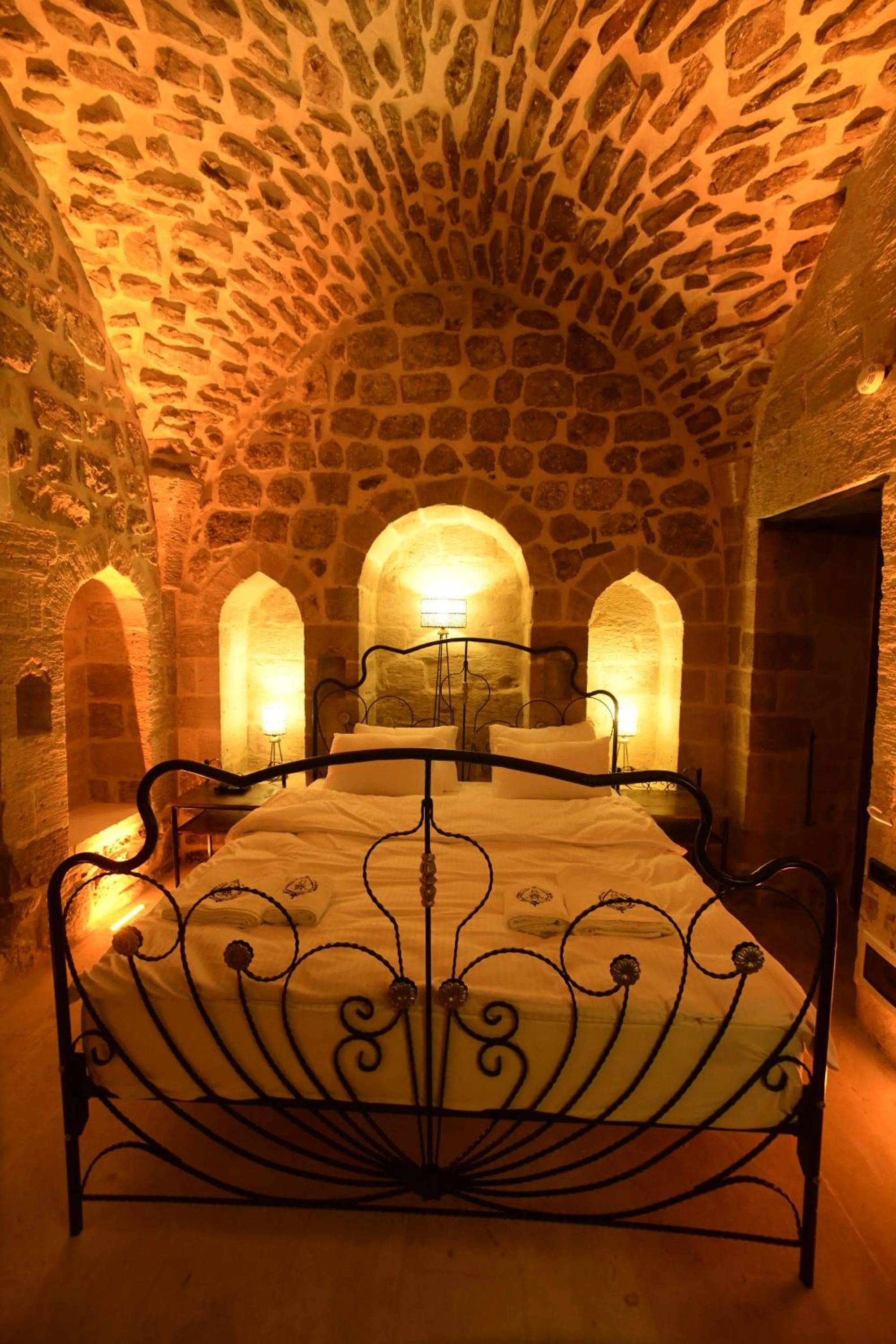 Bed in Legacy Mesopotamia Hotel