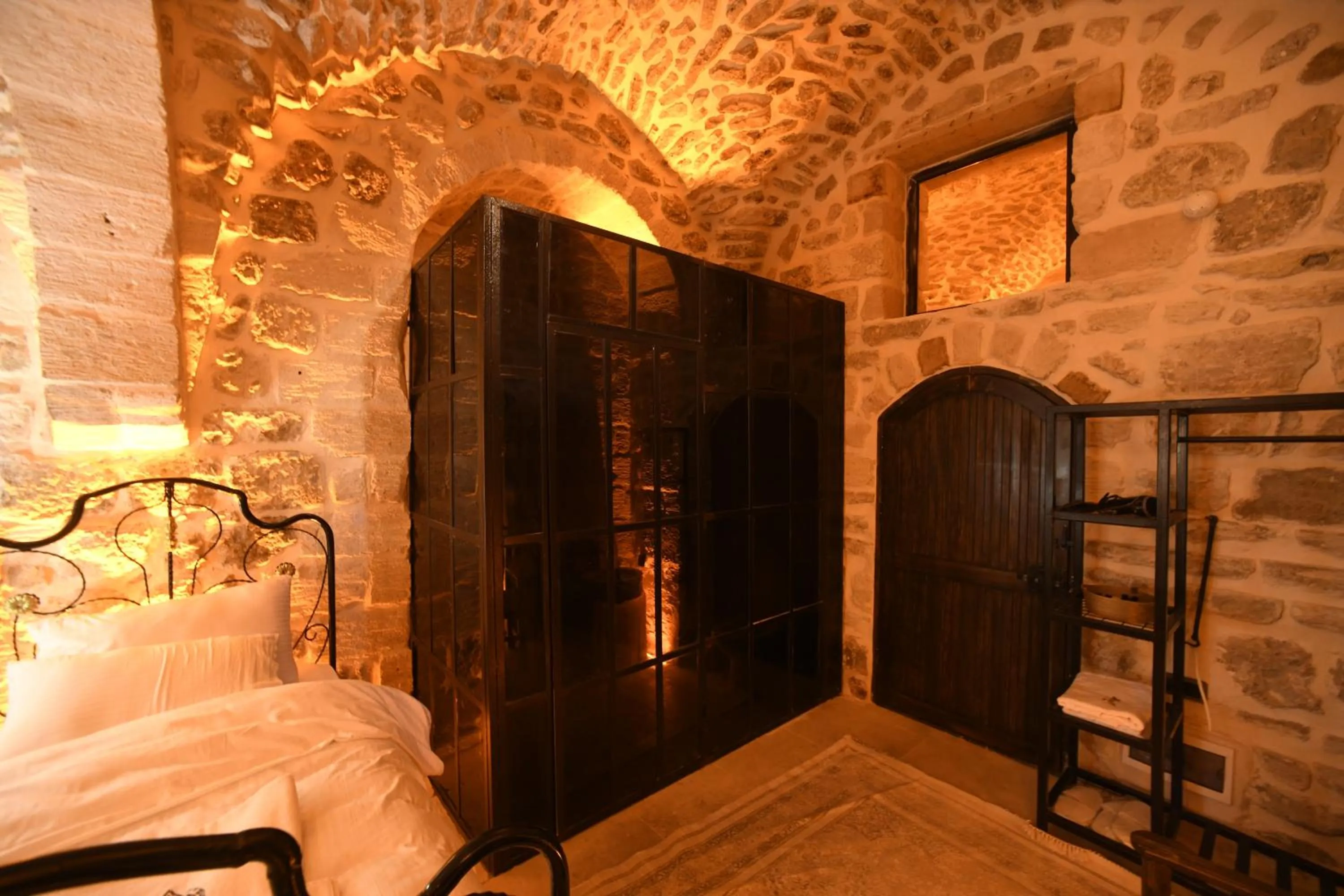 Bed in Legacy Mesopotamia Hotel