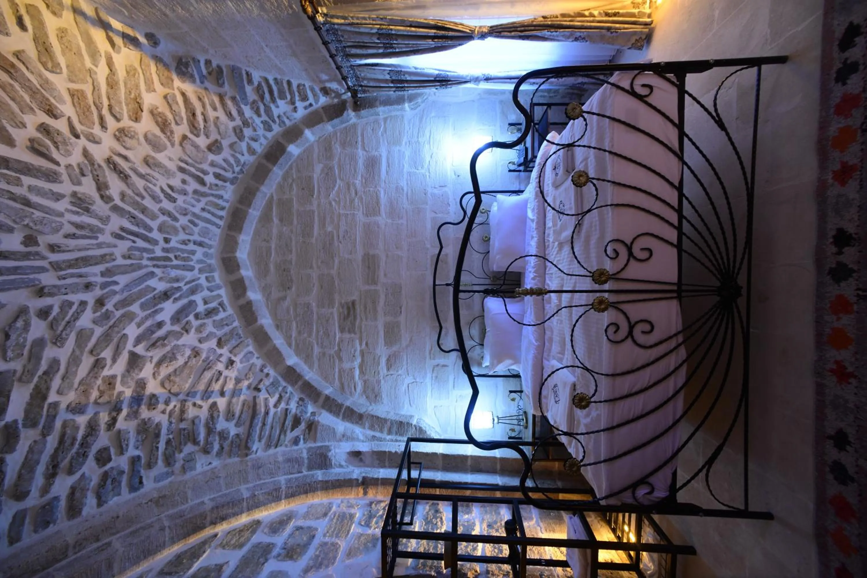 Bed in Legacy Mesopotamia Hotel