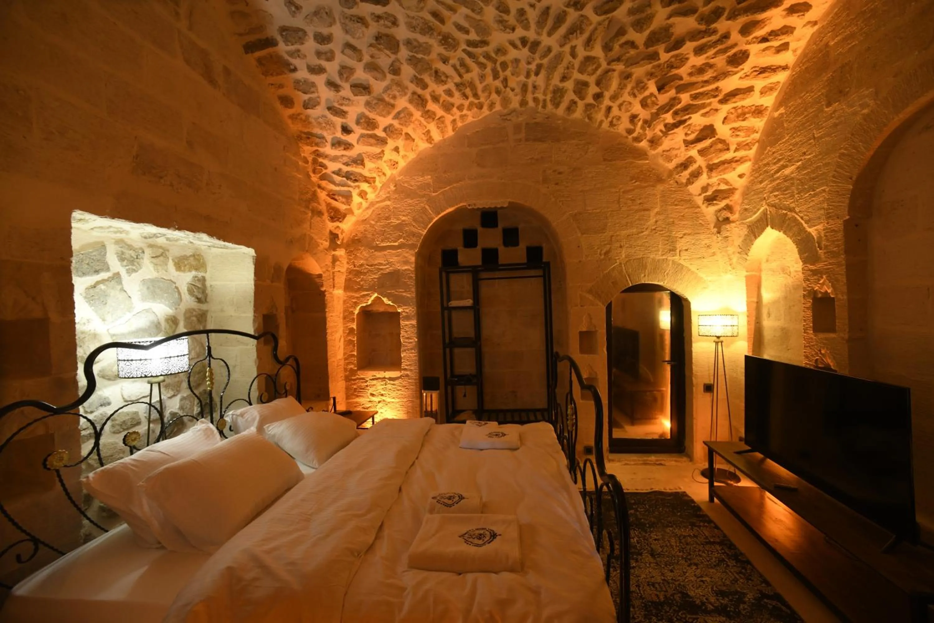 Bed in Legacy Mesopotamia Hotel