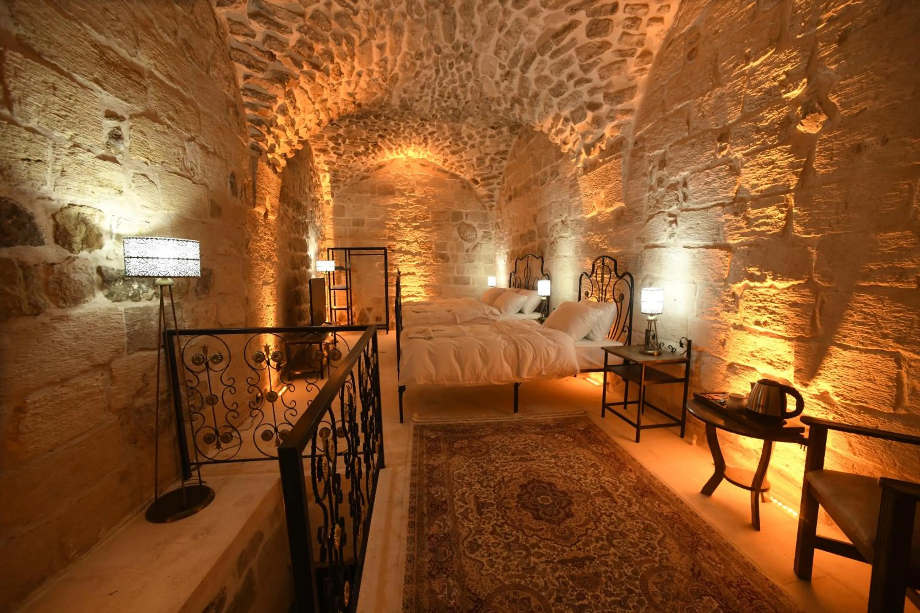 Bed in Legacy Mesopotamia Hotel