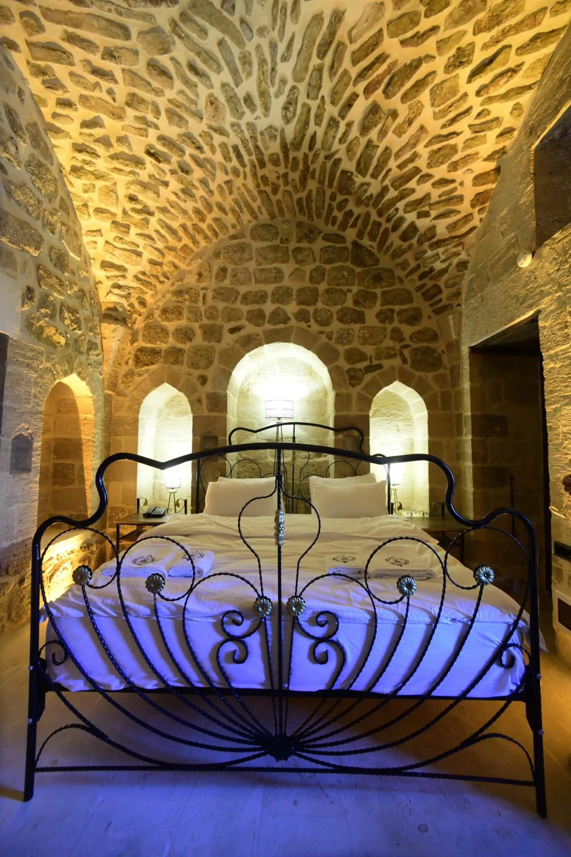 Bed in Legacy Mesopotamia Hotel