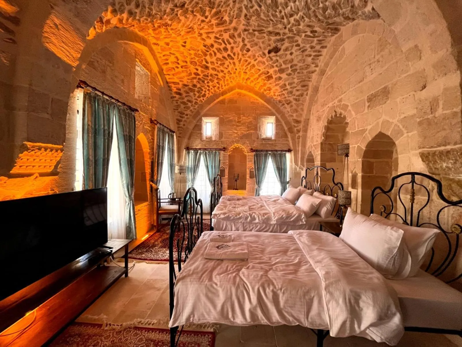 Bed in Legacy Mesopotamia Hotel