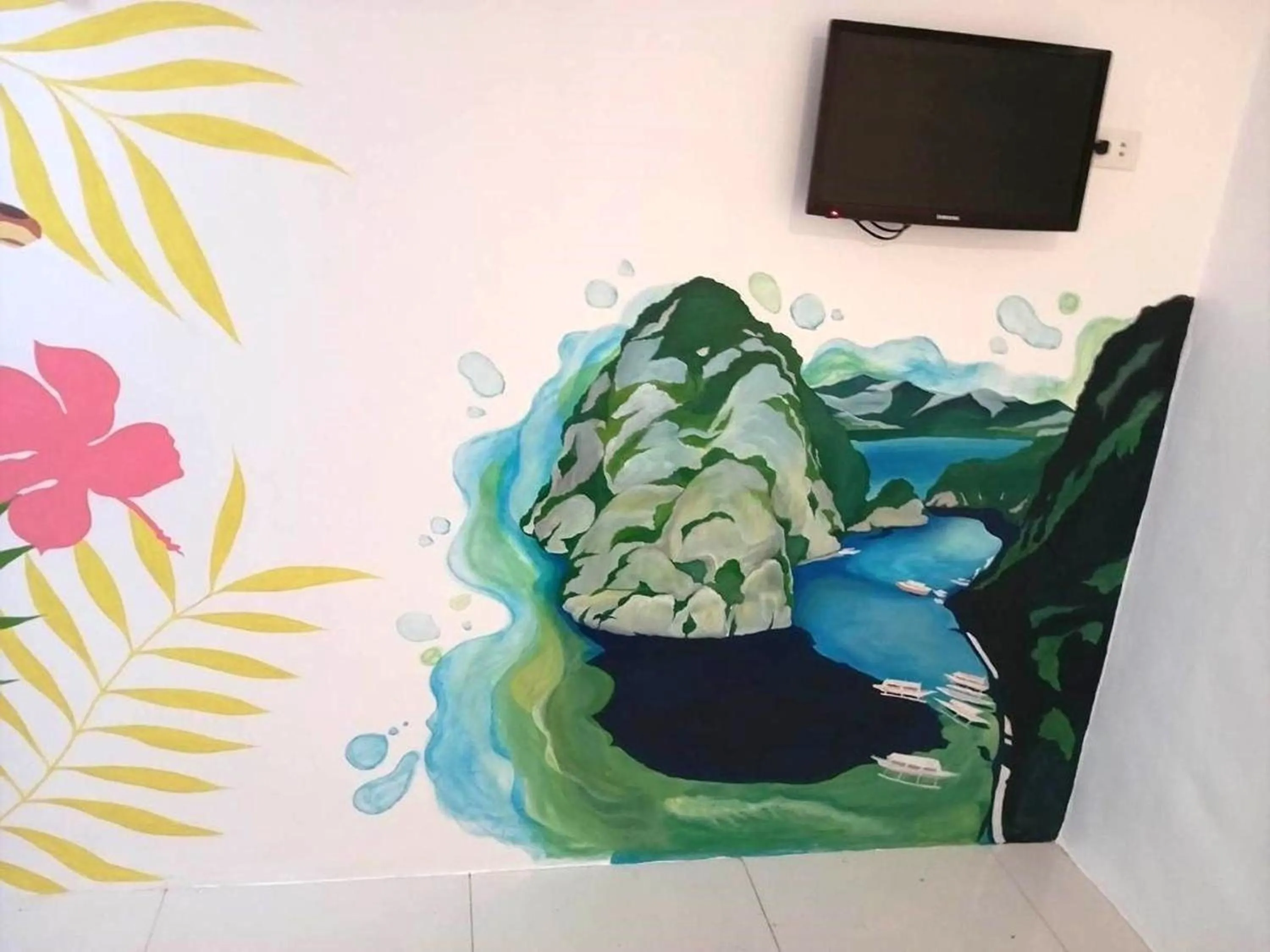 TV and multimedia in Wanderlust Bed and Breakfast Puerto Princesa