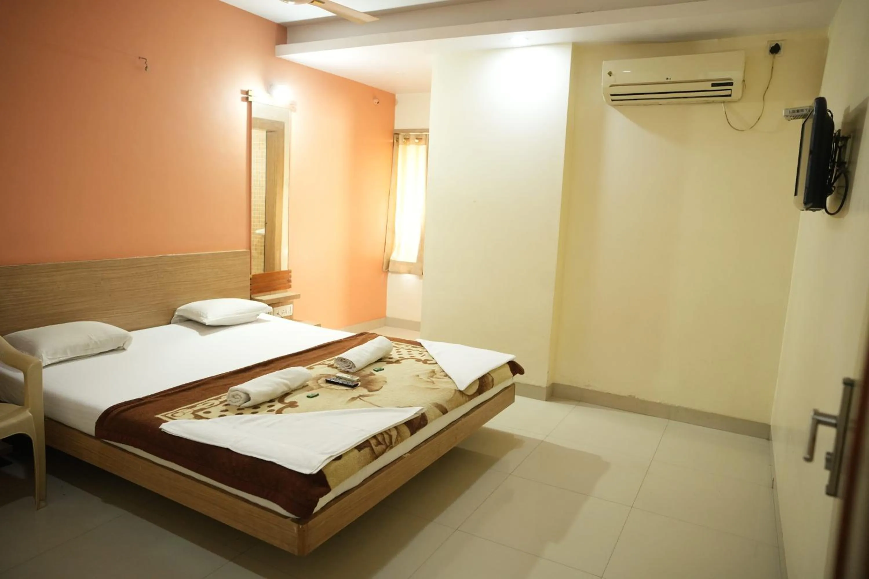 Bed in HOTEL SAI SURYA