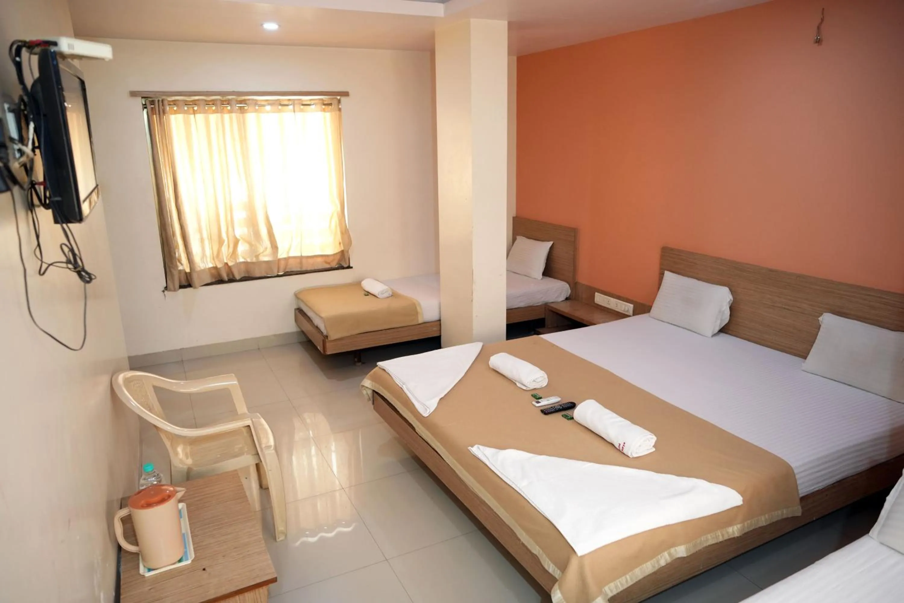 Communal lounge/ TV room, Bed in HOTEL SAI SURYA