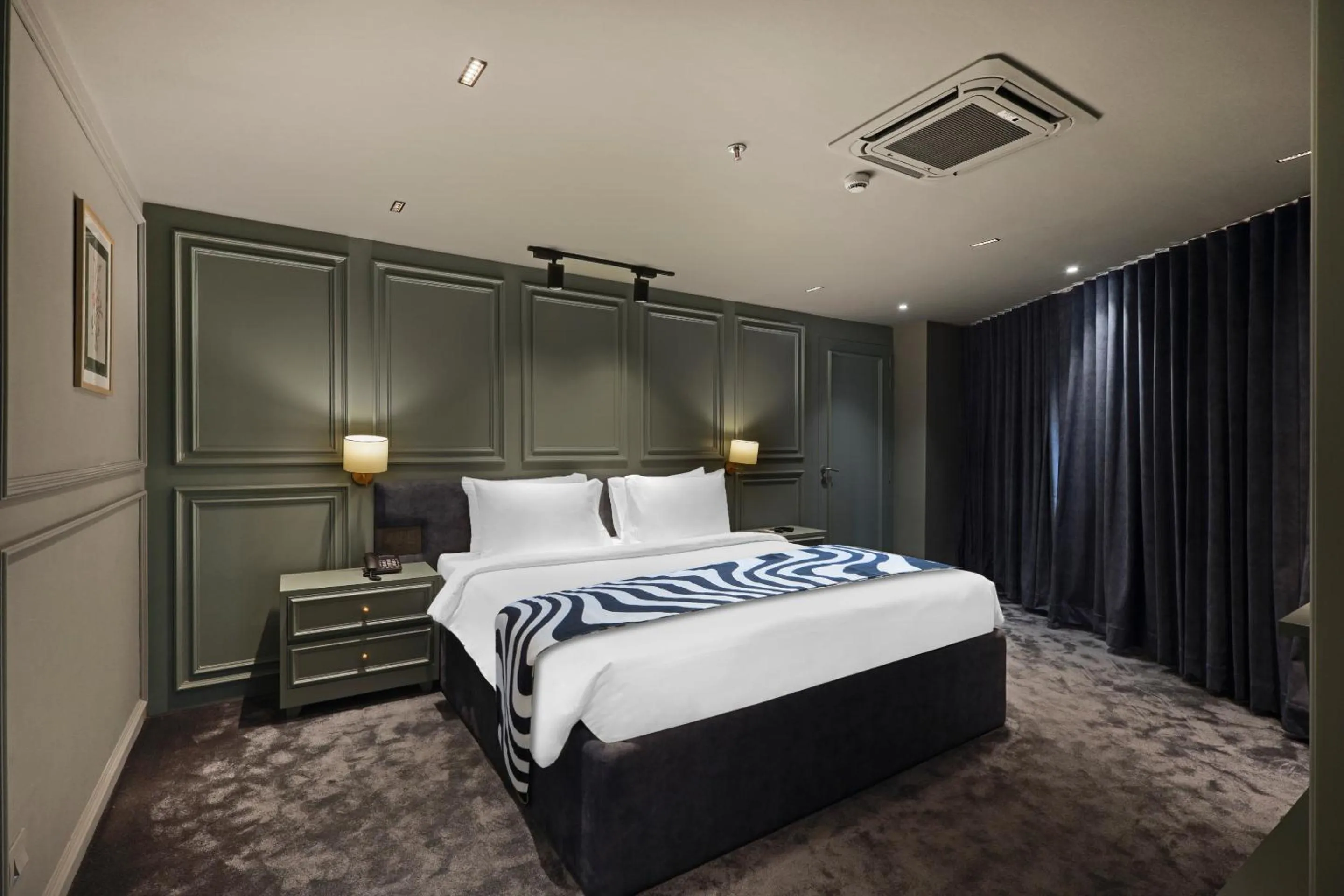 Bed in Sunday Hotel Vadodara