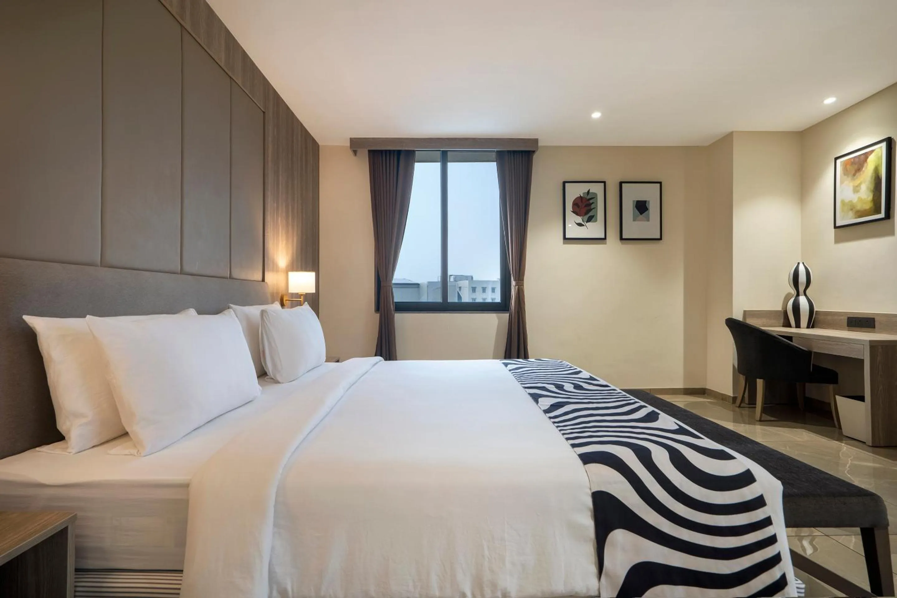 Photo of the whole room, Bed in Sunday Hotel Vadodara