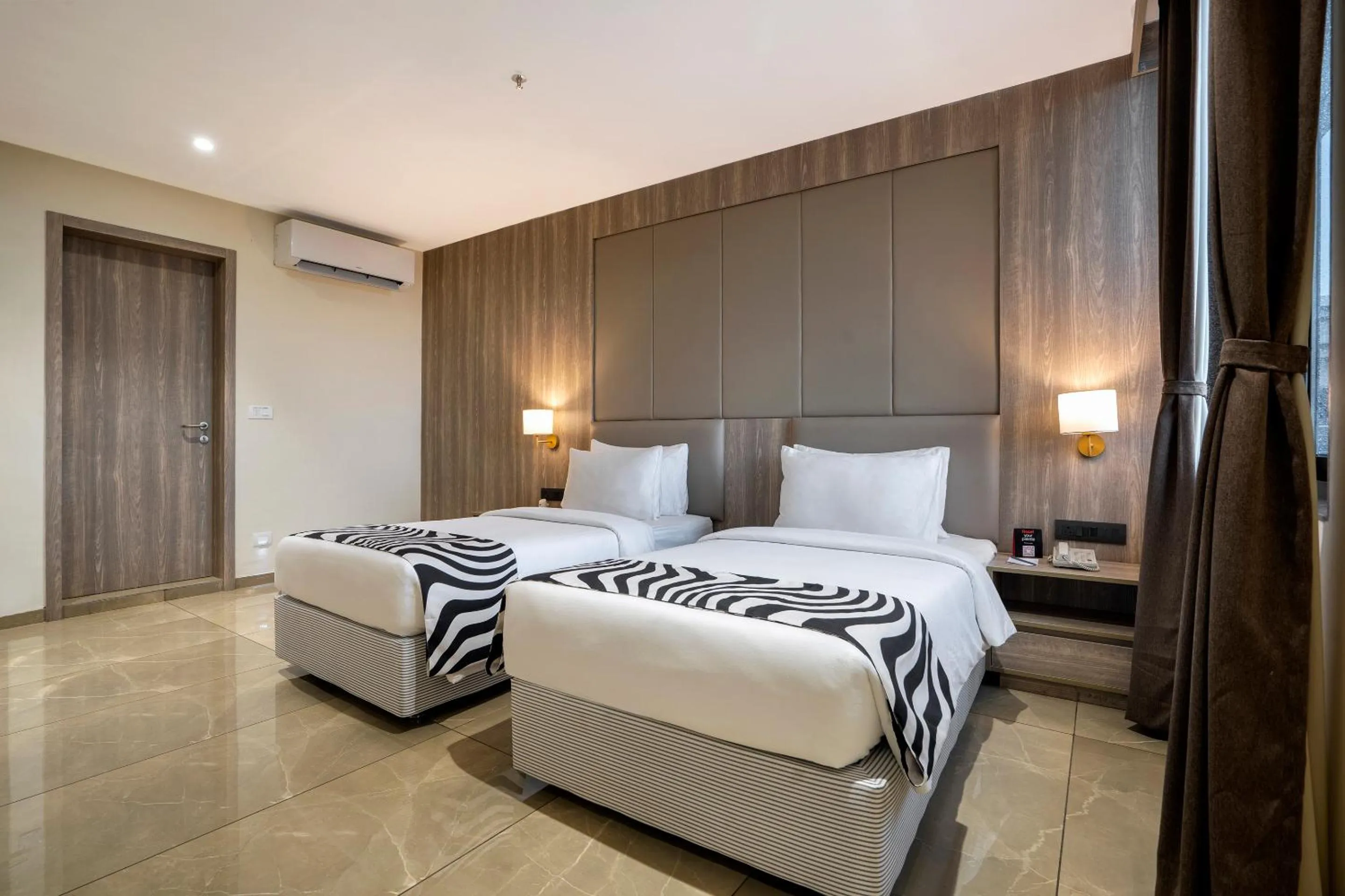 Bed in Sunday Hotel Vadodara