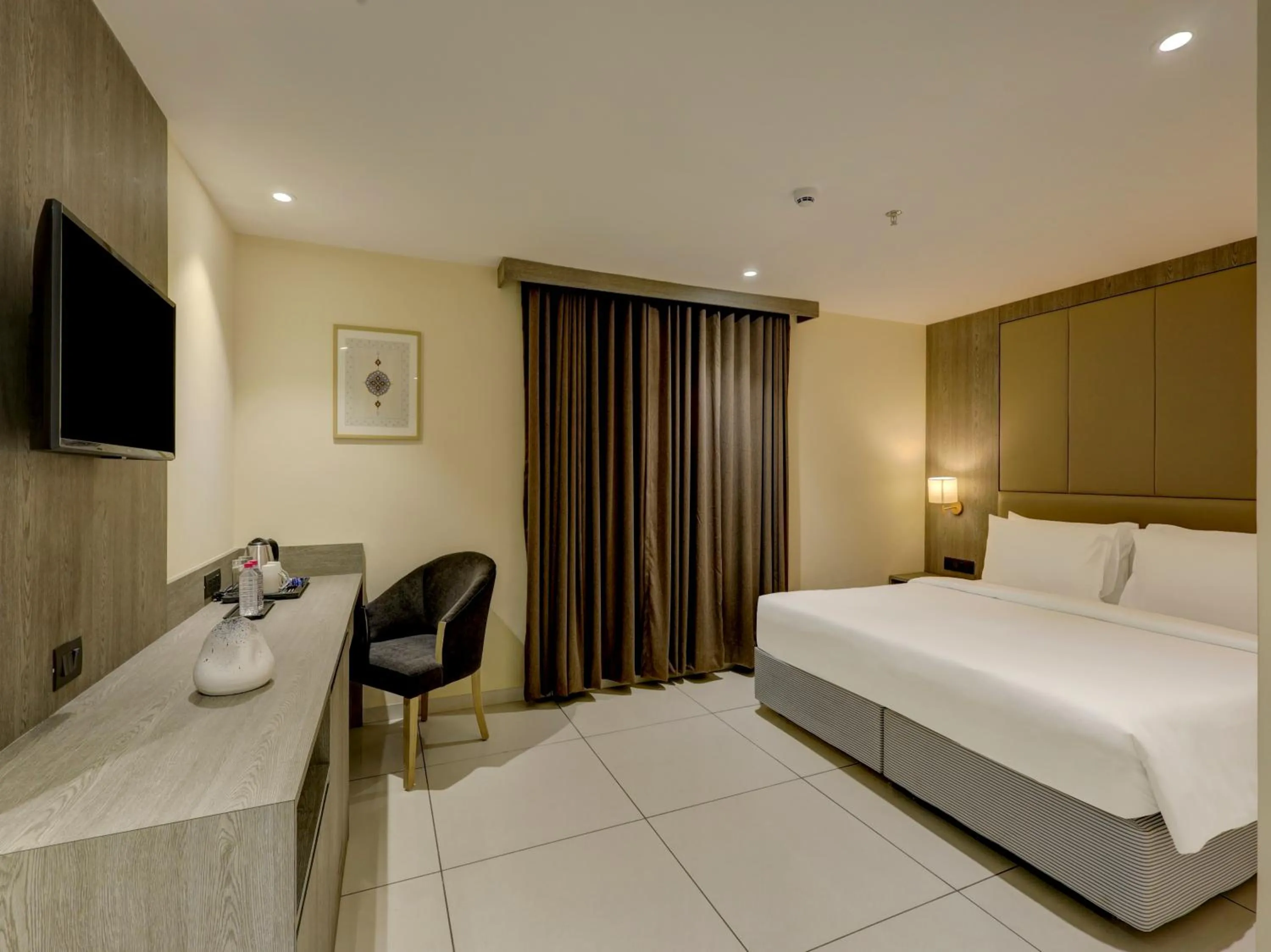 Bed in Sunday Hotel Vadodara