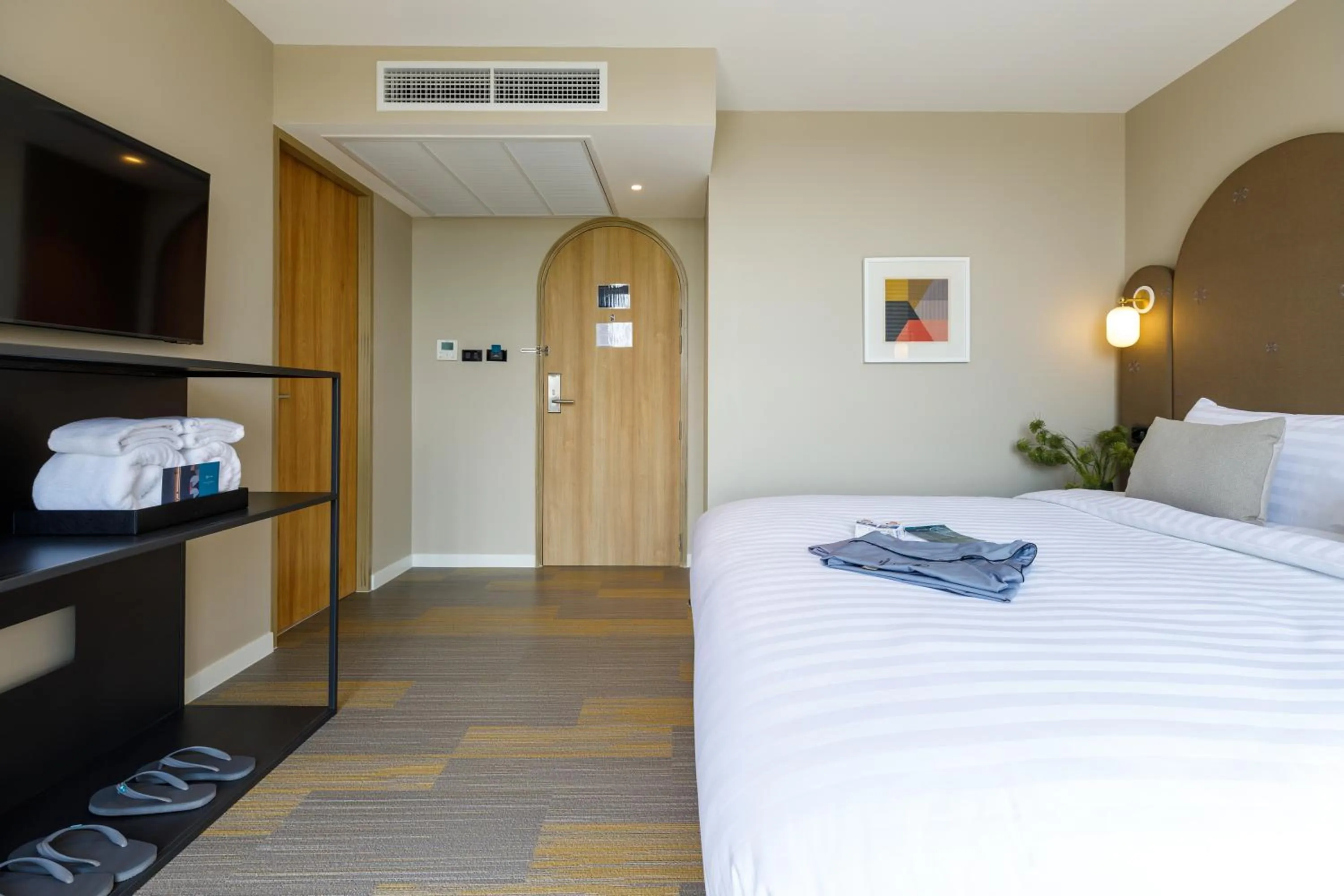 Bed in Benjarong Hotel Bangkok Ratchada