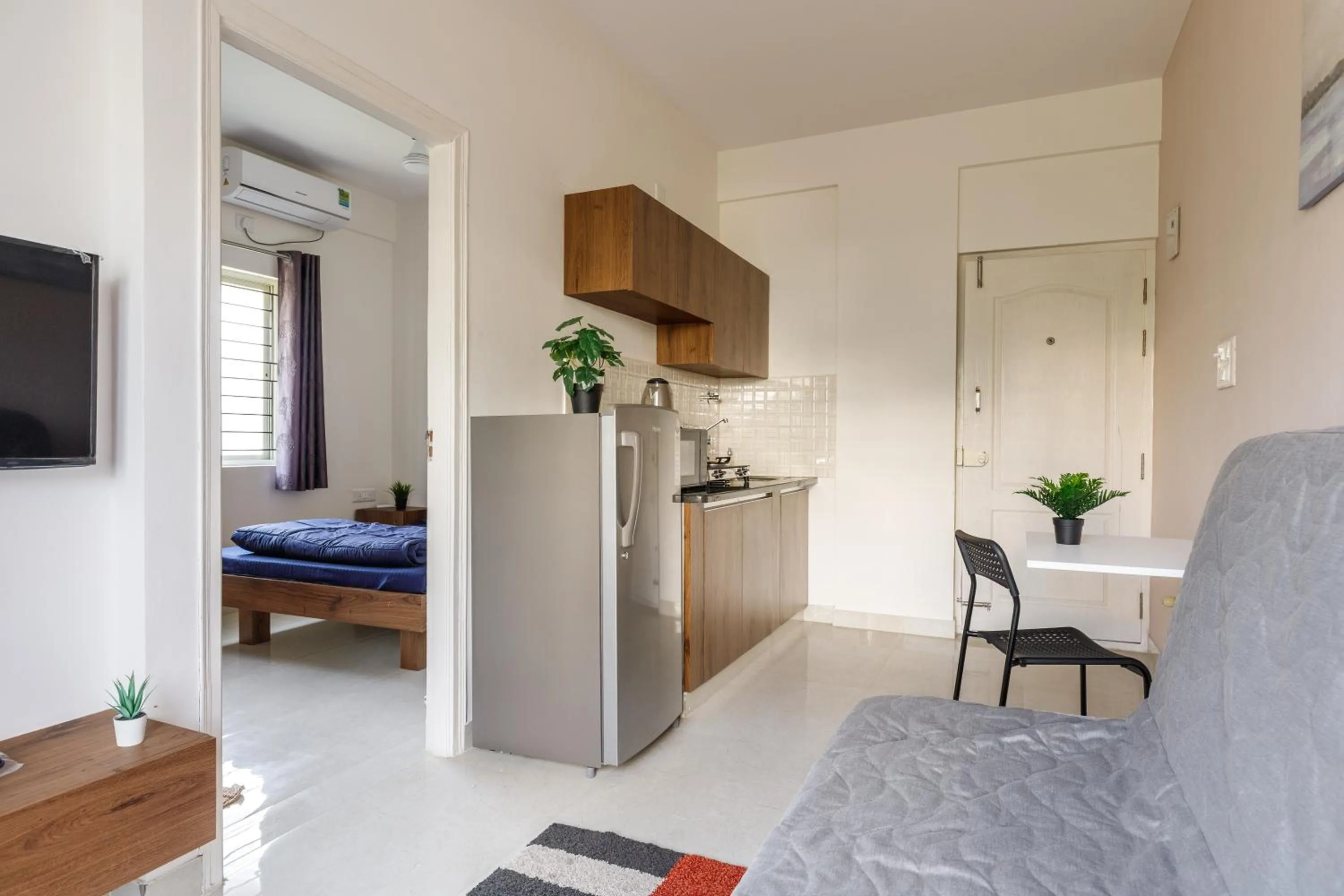 Bed in Sunrise Service Apartments