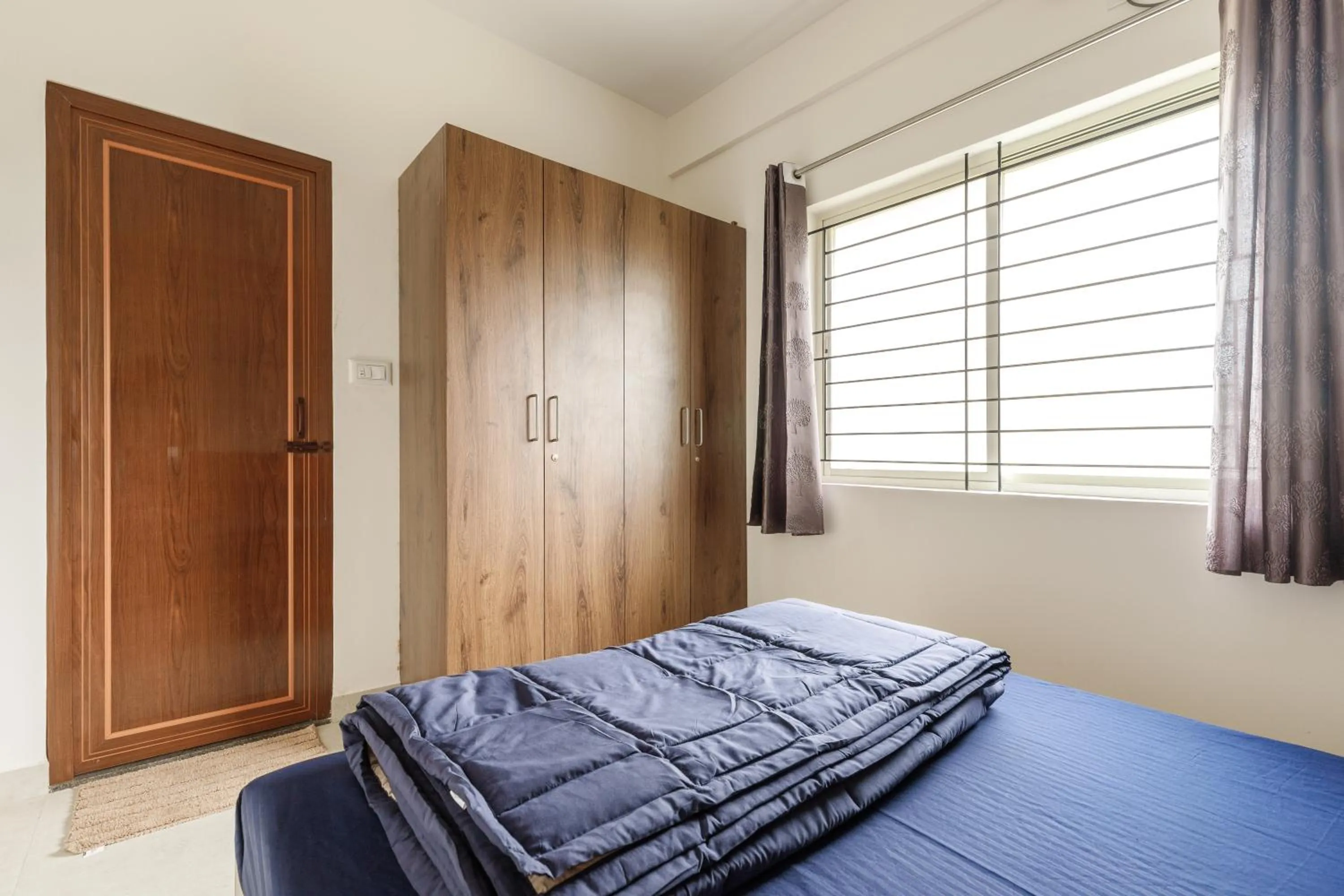 Bed in Sunrise Service Apartments