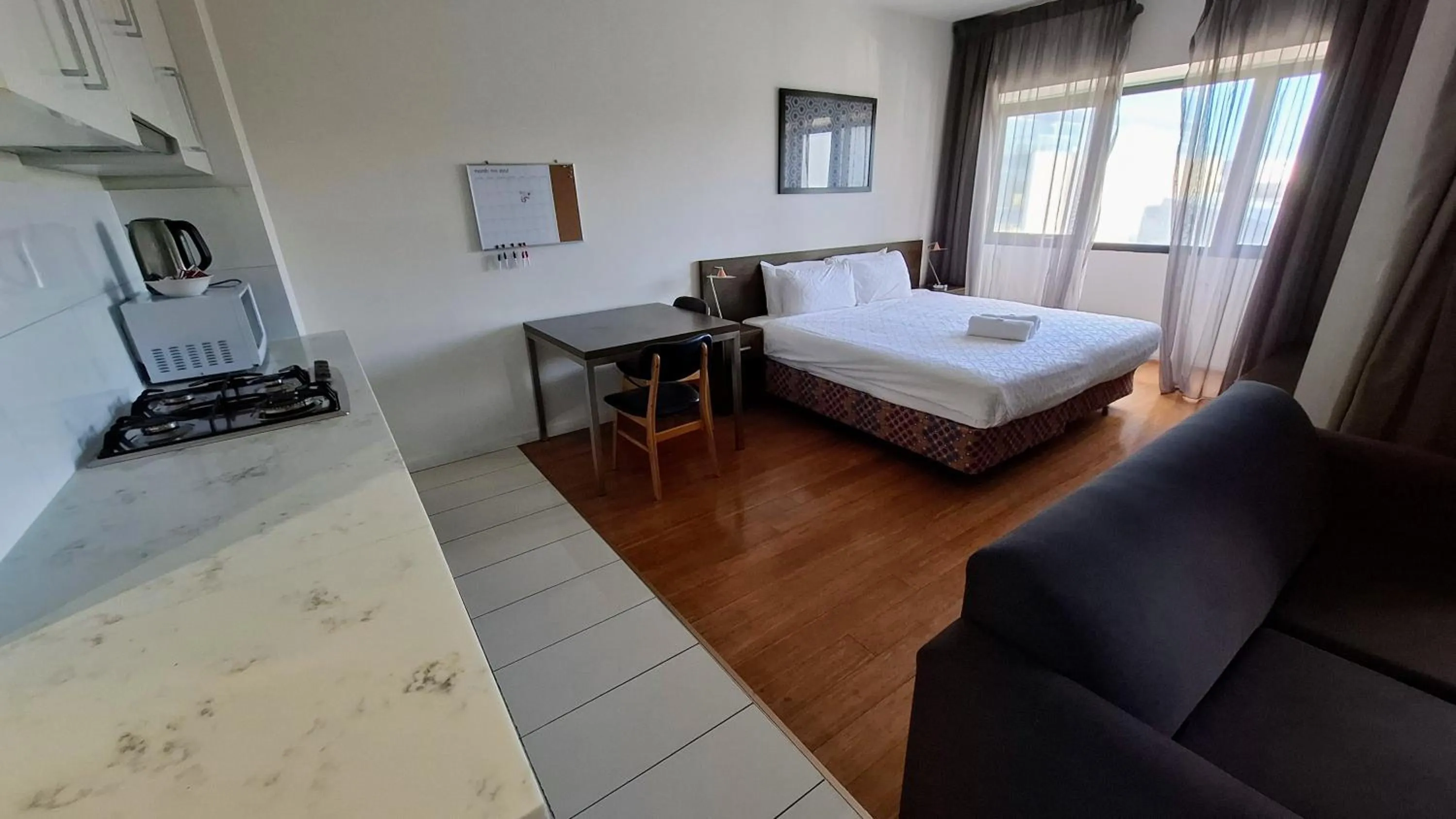 Bed in Exodus Dandenong Apartment Hotel