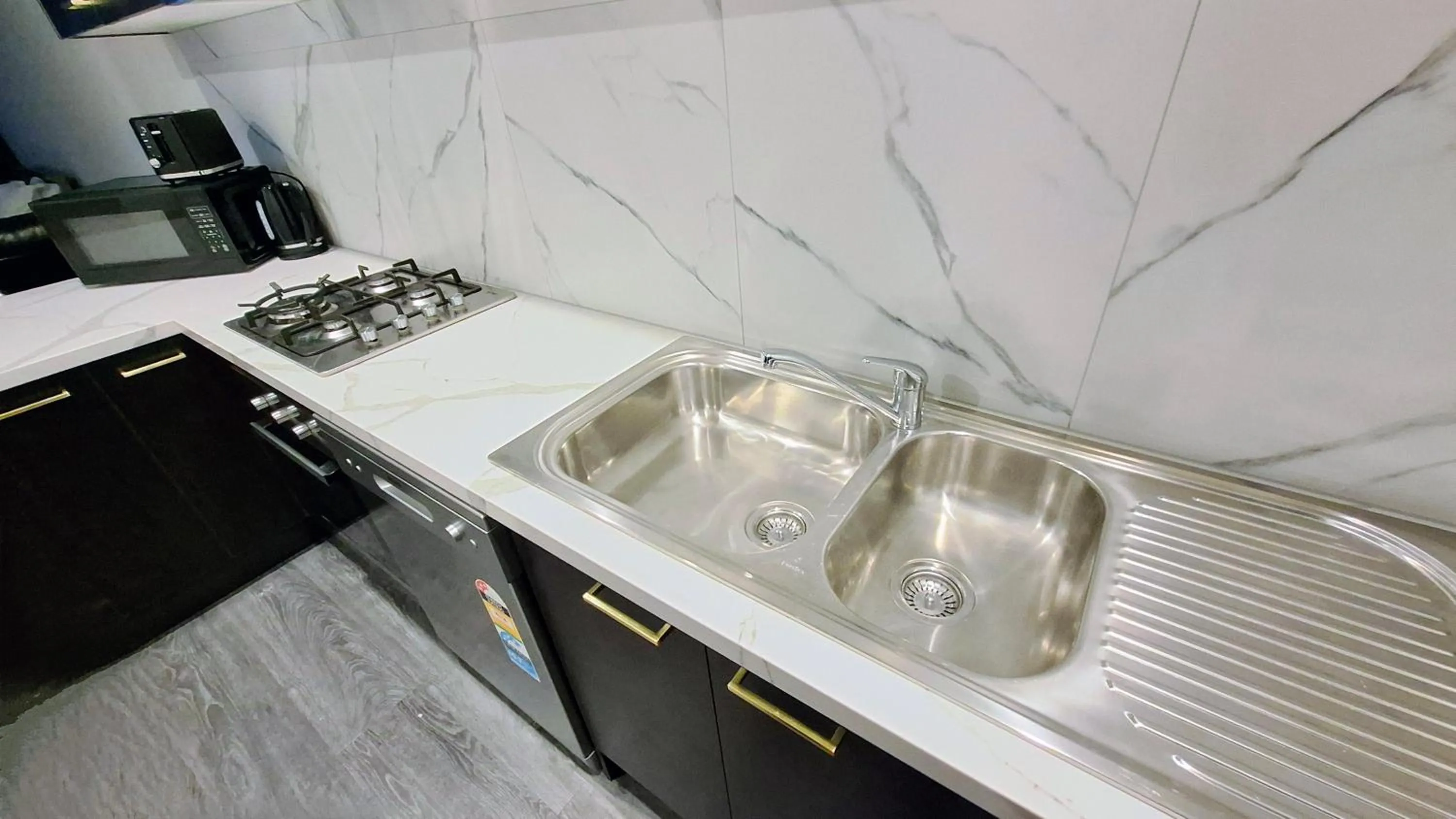 Kitchen or kitchenette in Exodus Dandenong Apartment Hotel