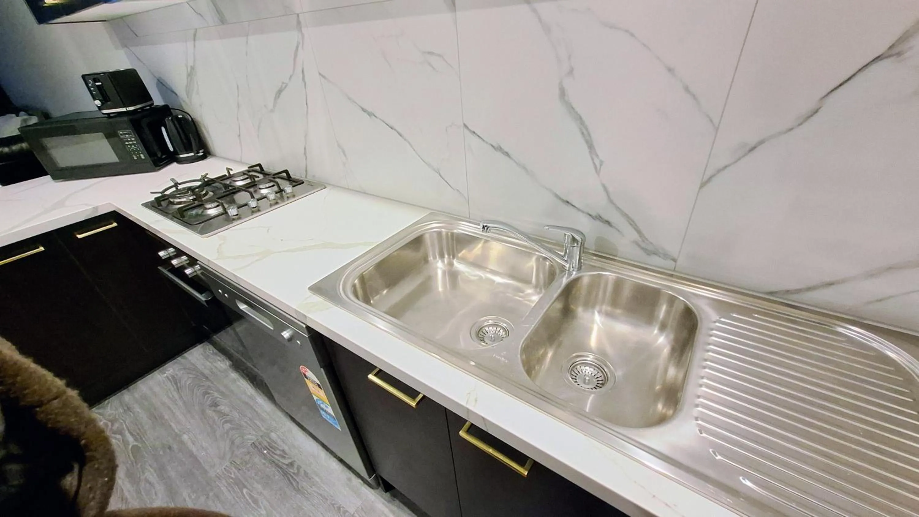Kitchen or kitchenette in Exodus Dandenong Apartment Hotel