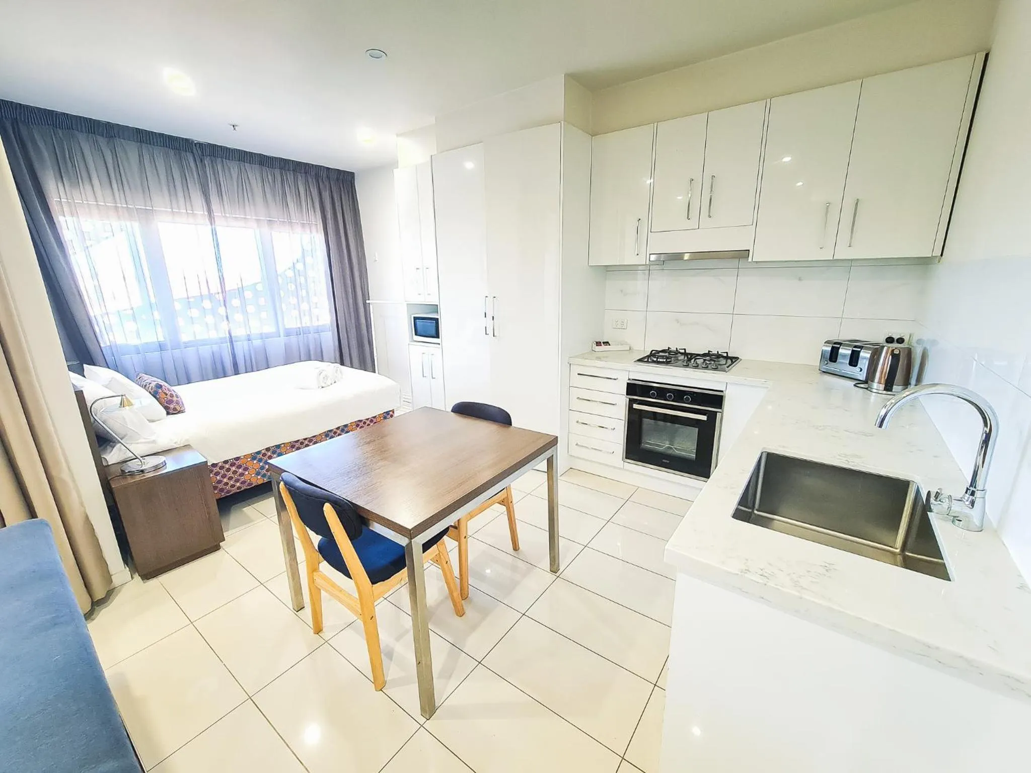 Bed in Exodus Dandenong Apartment Hotel