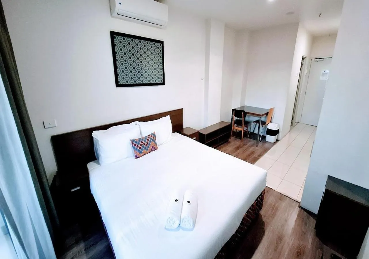 Bed in Exodus Dandenong Apartment Hotel