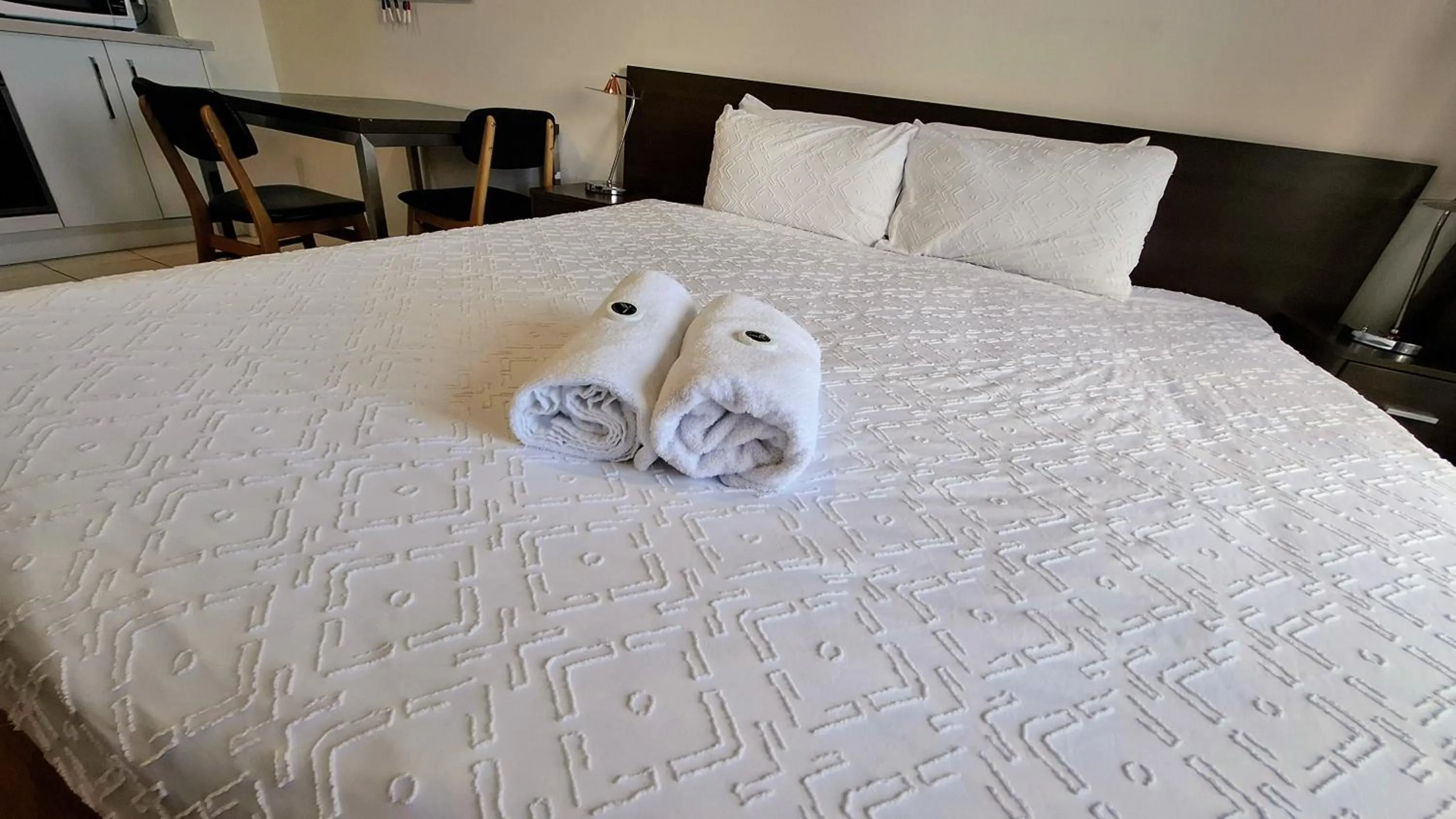 Bed in Exodus Dandenong Apartment Hotel