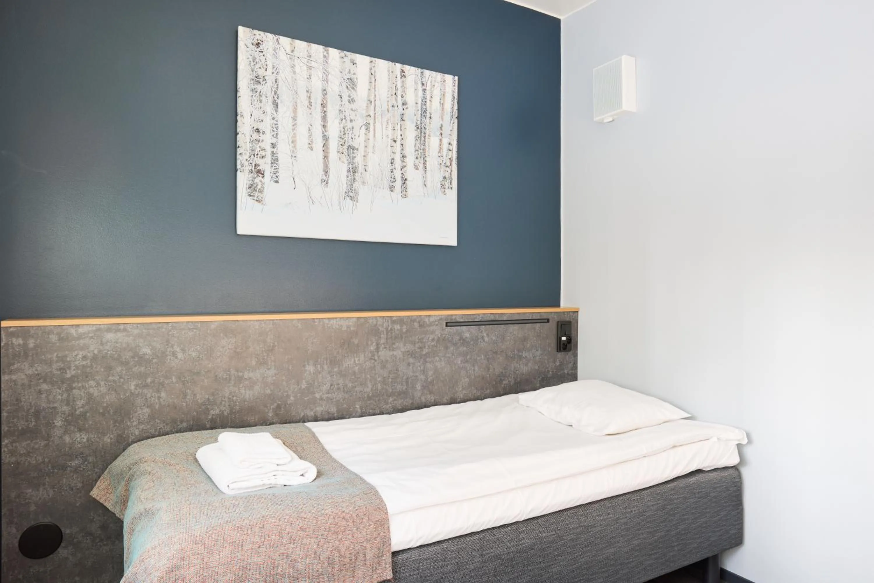 Bed in Hotel Linnasmäki