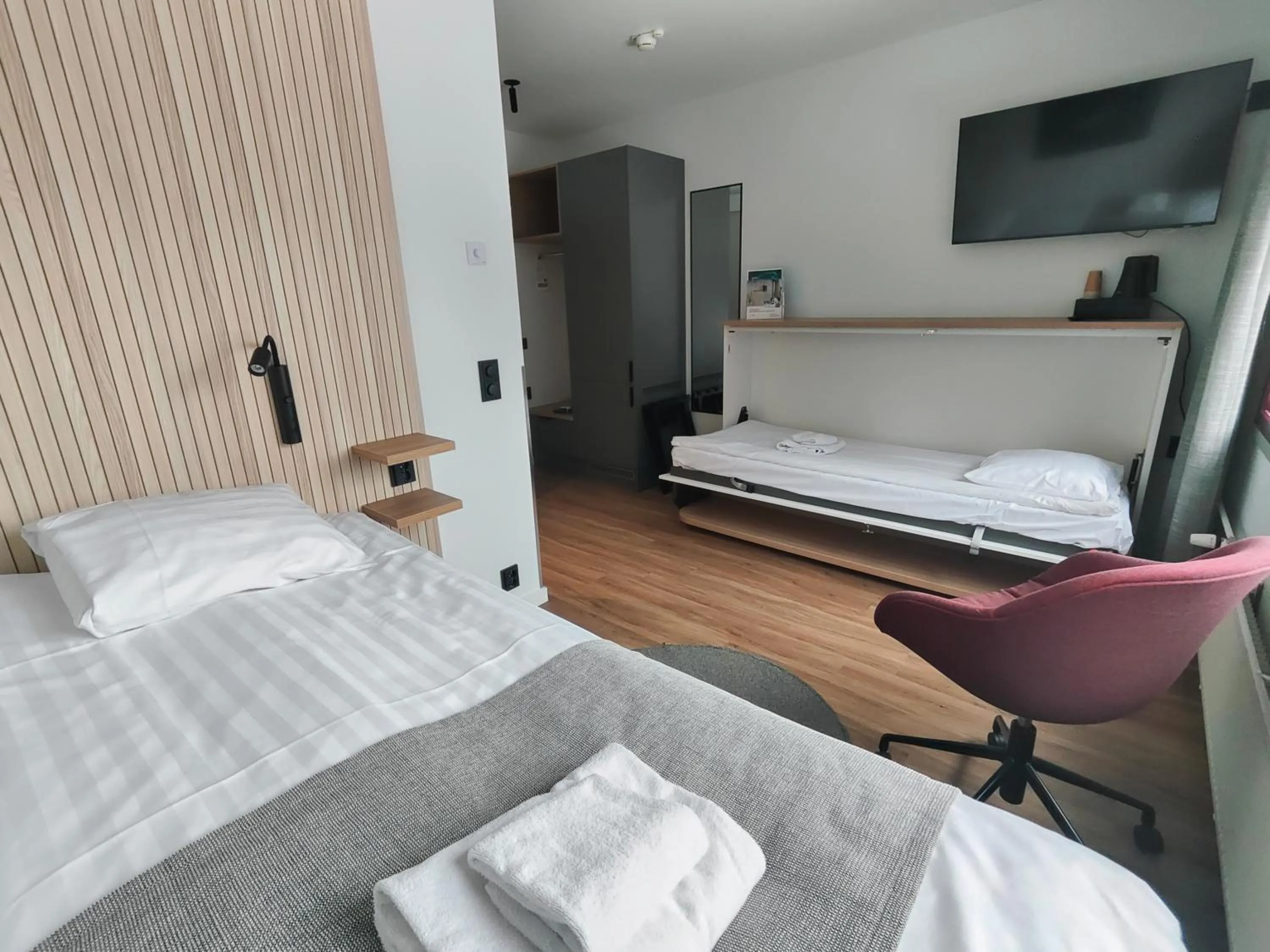 Bed in Hotel Linnasmäki