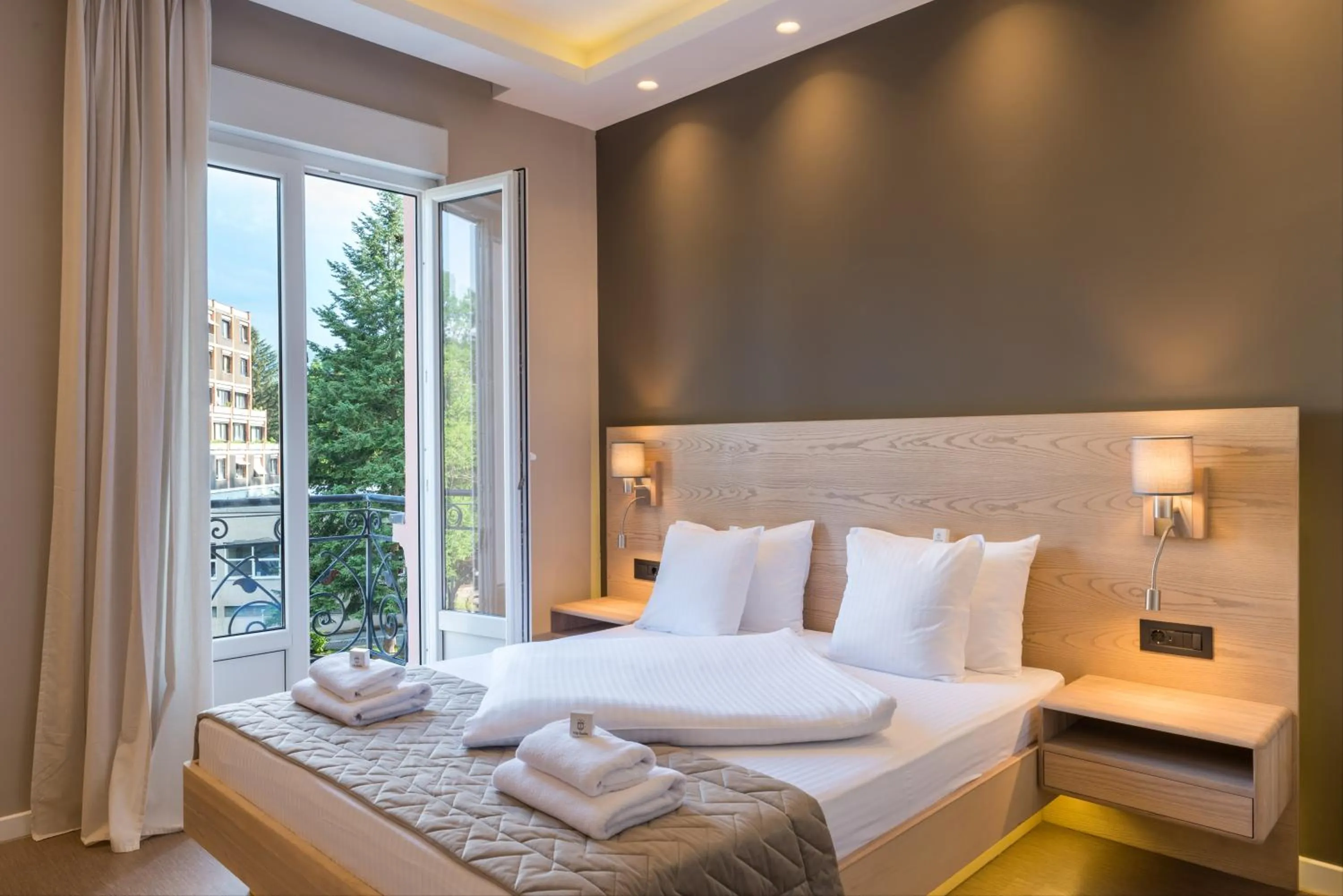 Bed in Emilia Lux Rooms