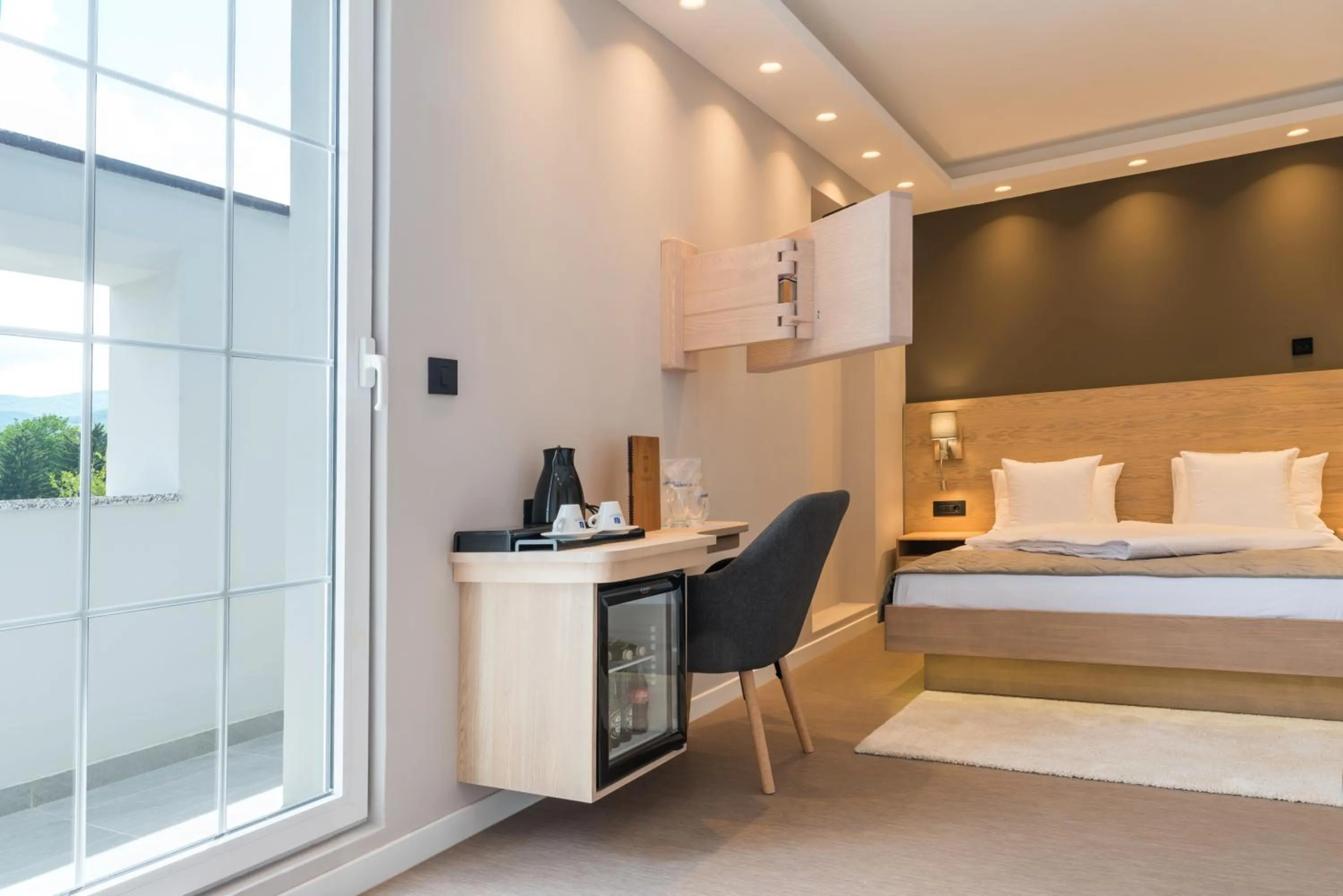 Bed in Emilia Lux Rooms