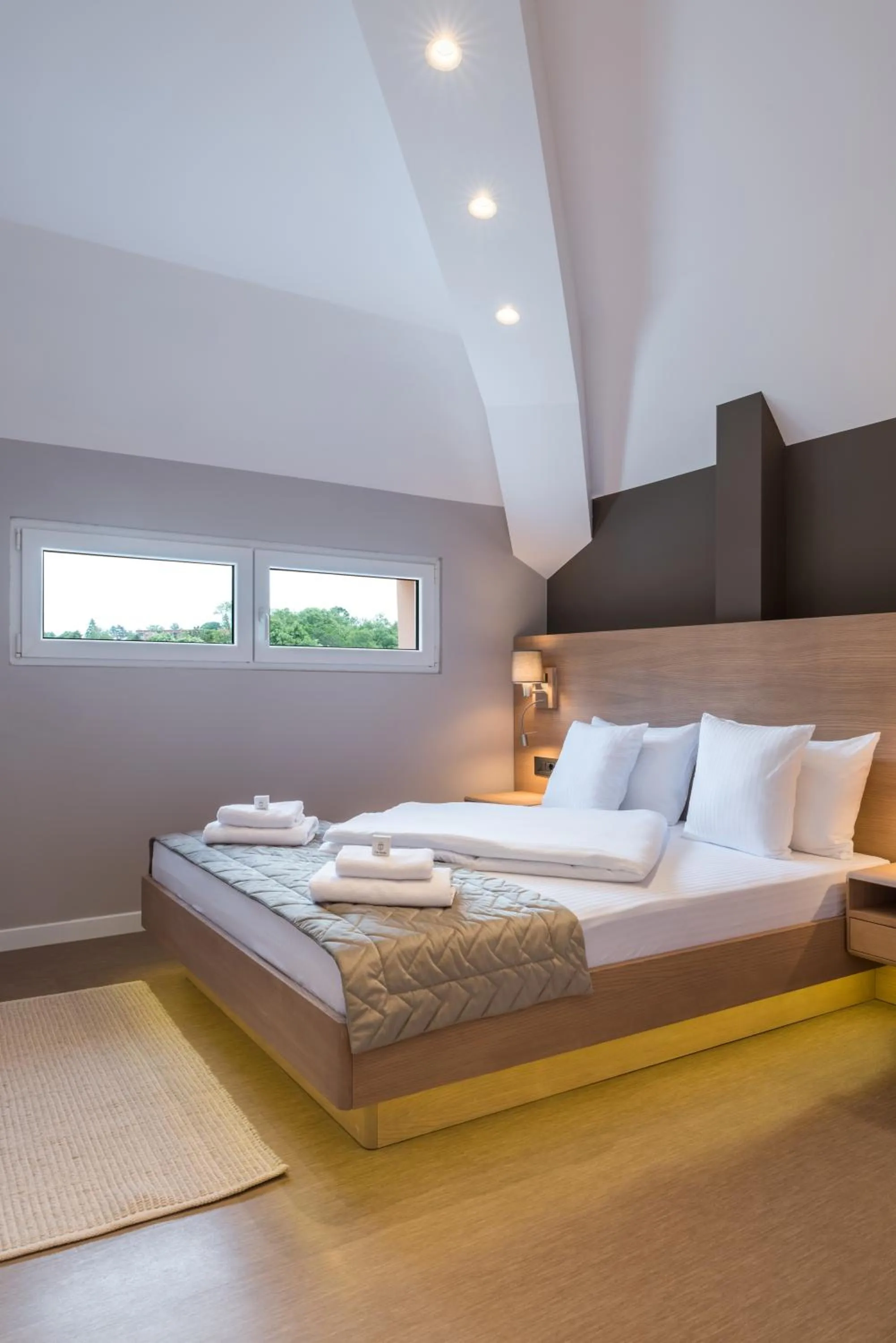 Bed in Emilia Lux Rooms