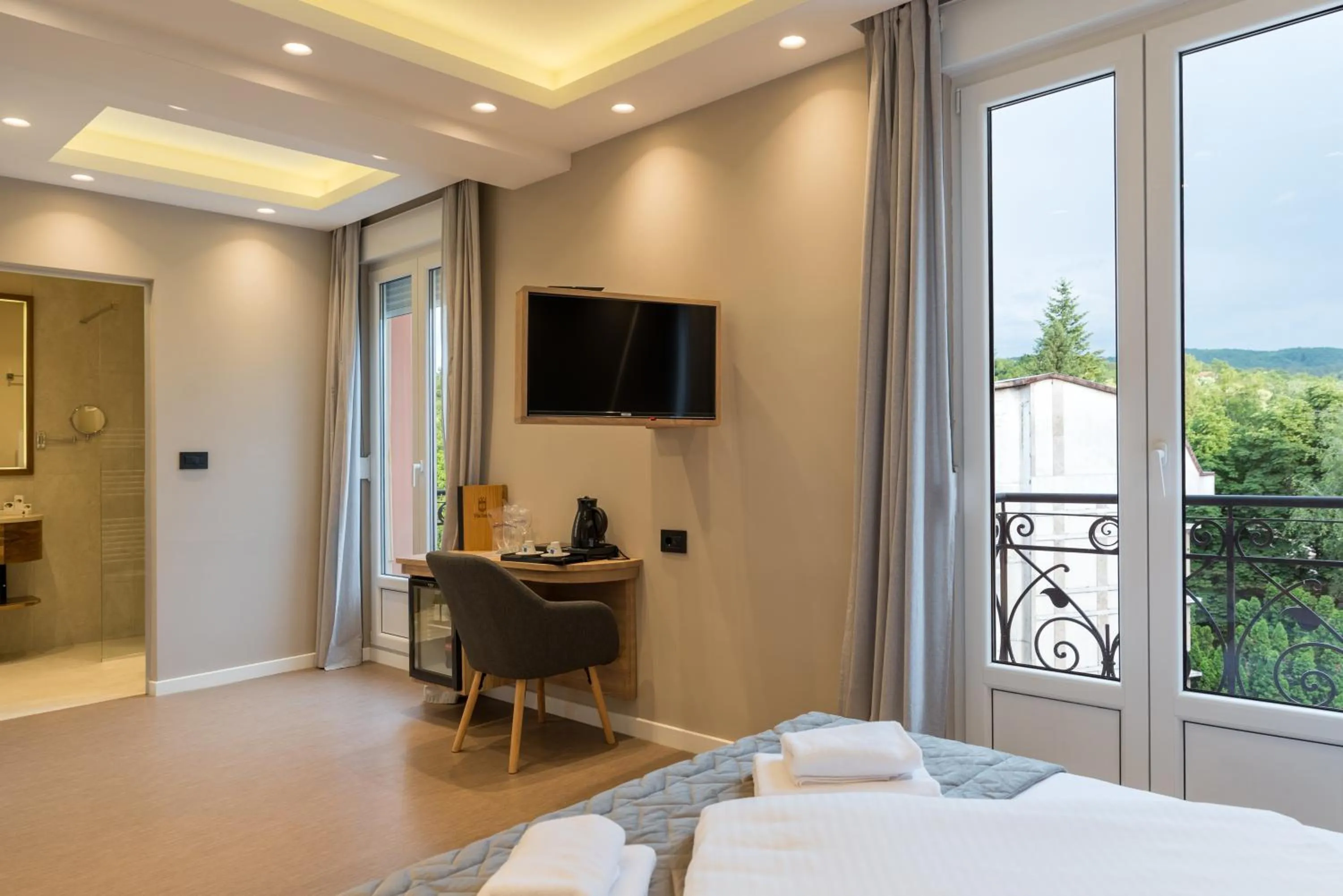 Bed in Emilia Lux Rooms