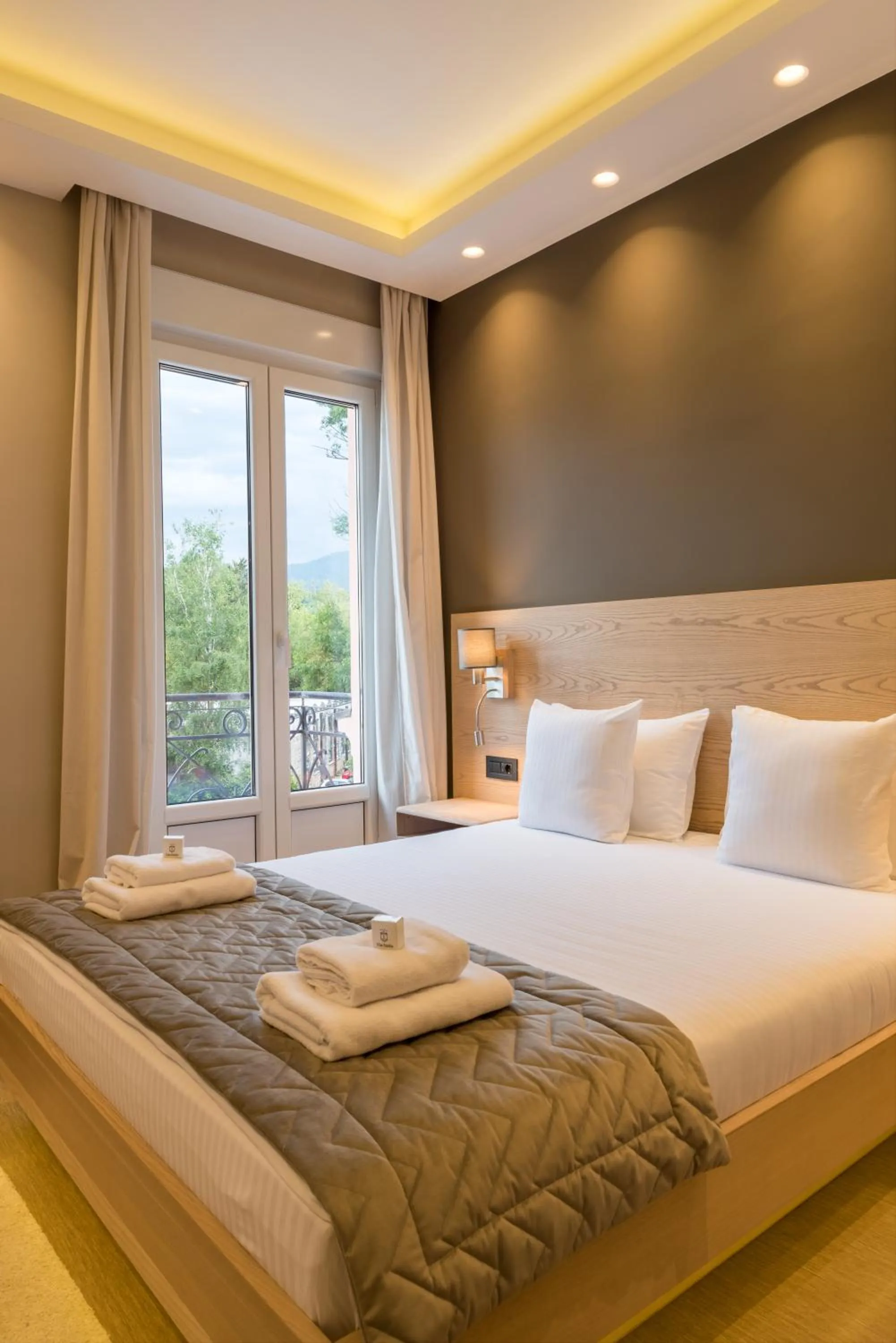 Bed in Emilia Lux Rooms