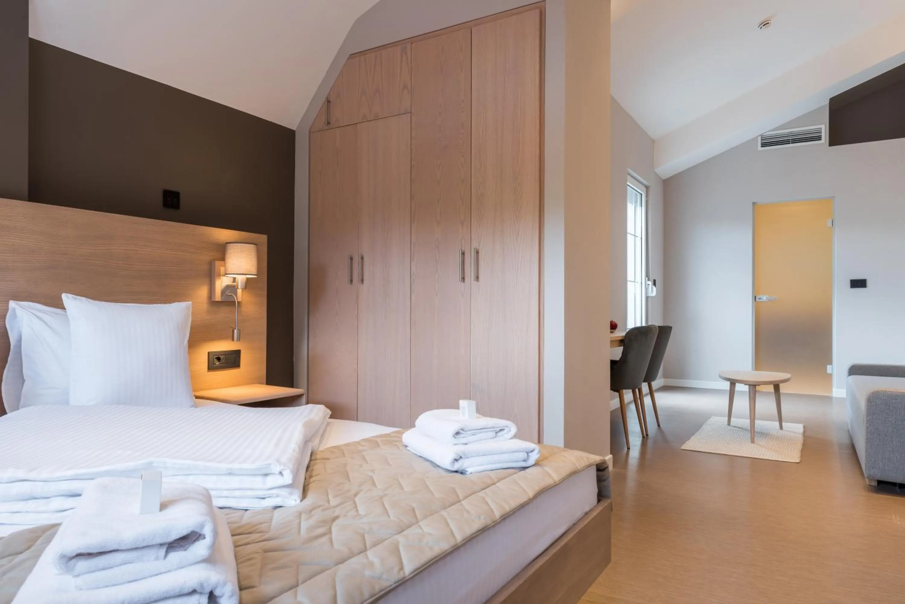 Bed in Emilia Lux Rooms