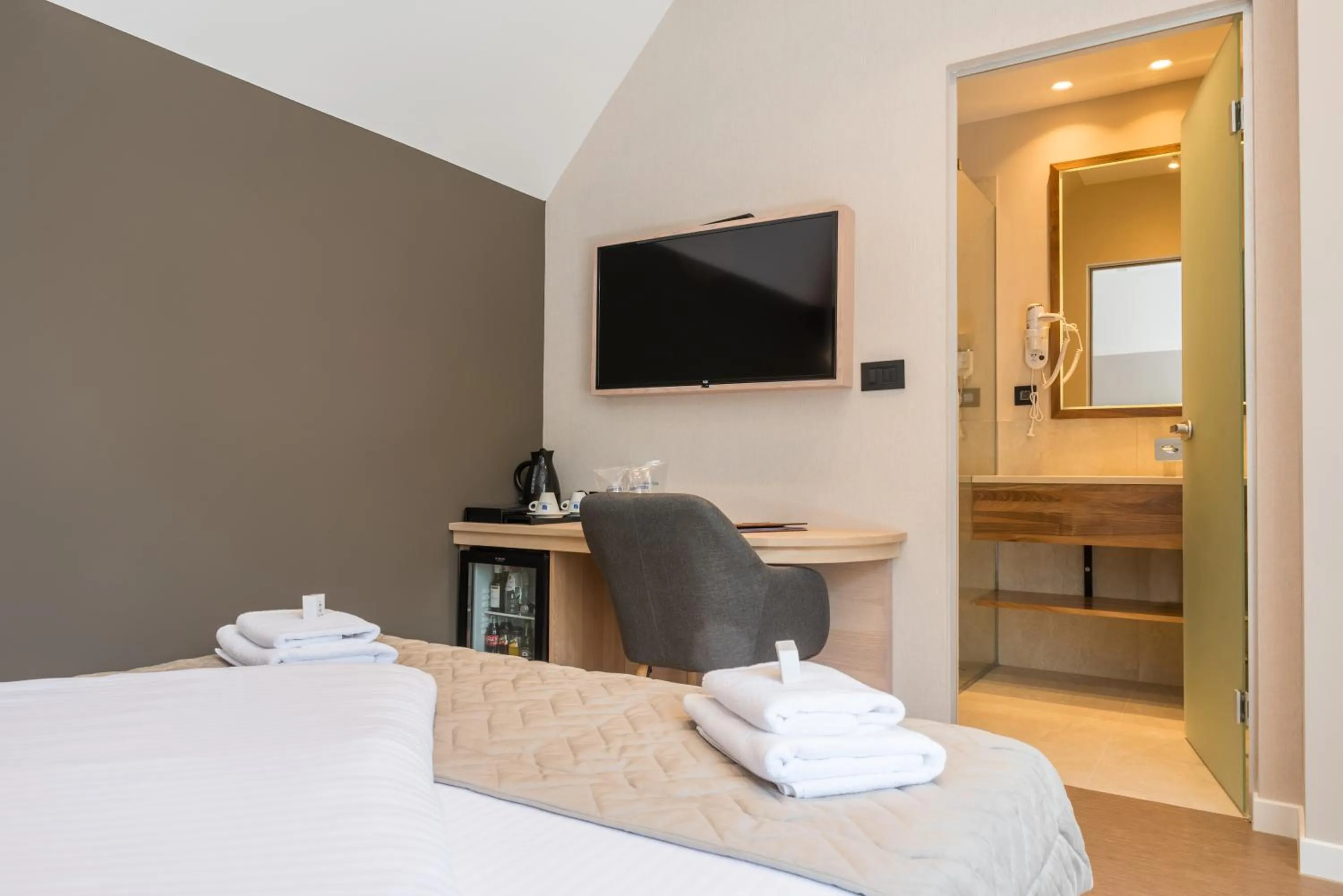 Bed in Emilia Lux Rooms