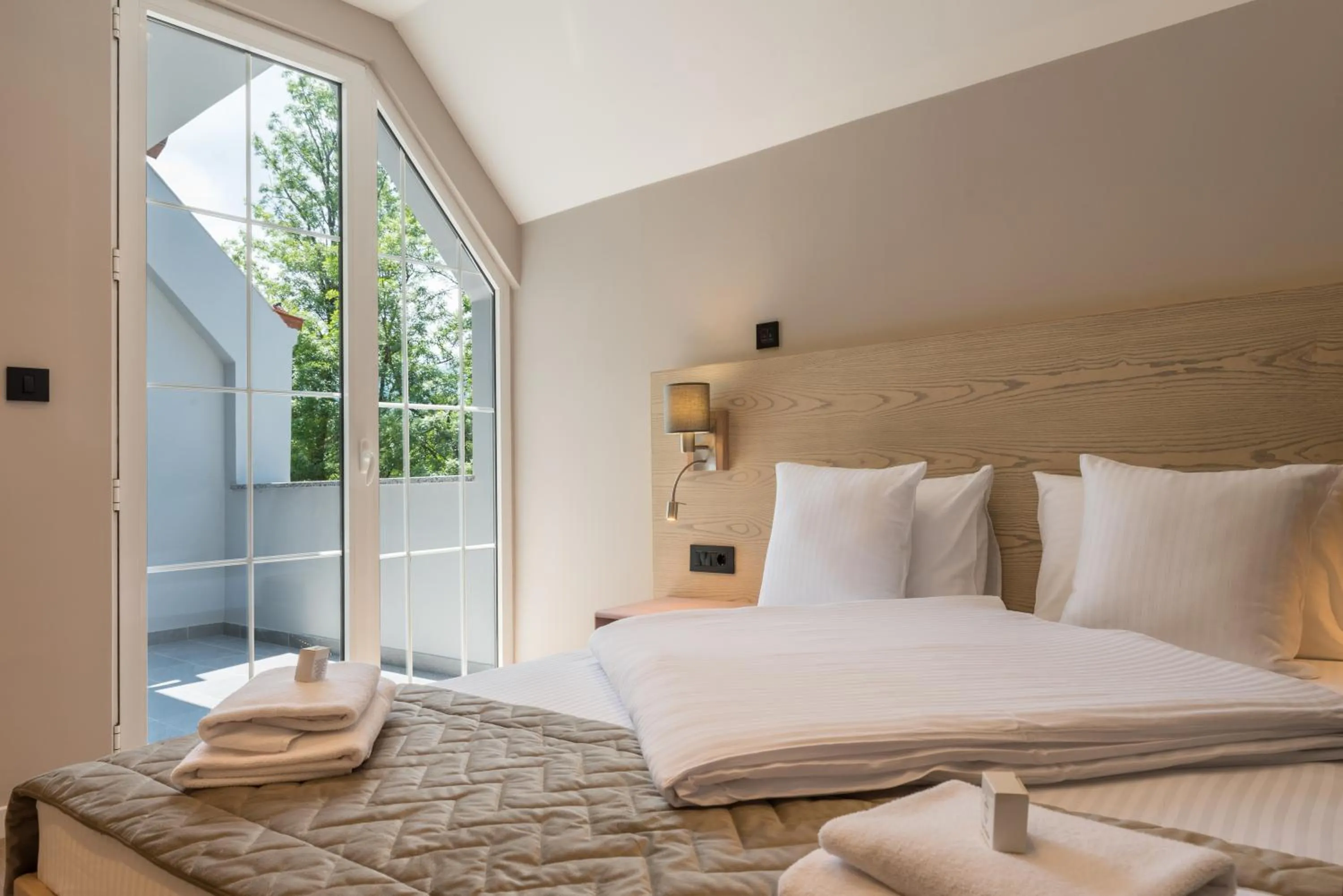 Bed in Emilia Lux Rooms