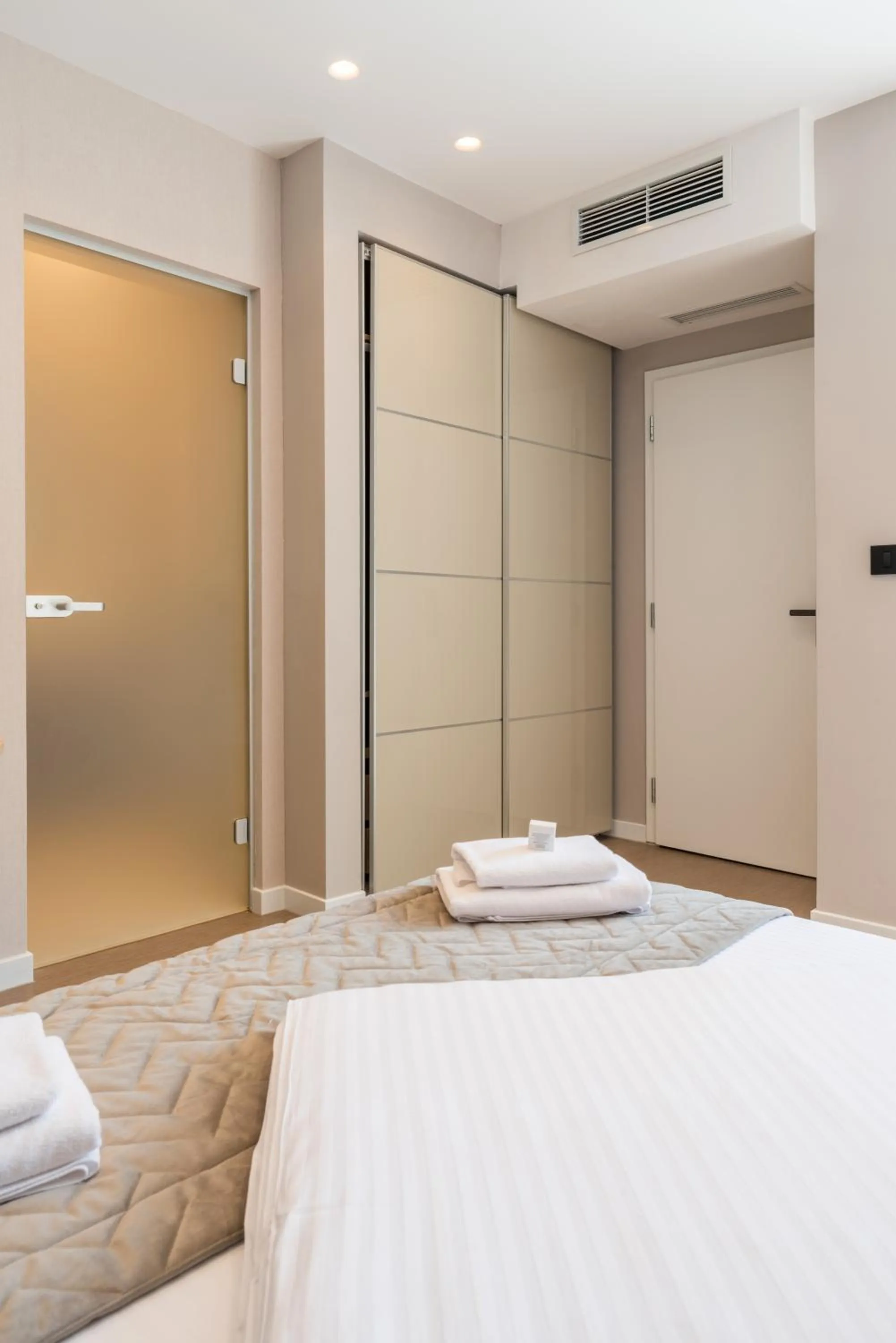 Bed in Emilia Lux Rooms