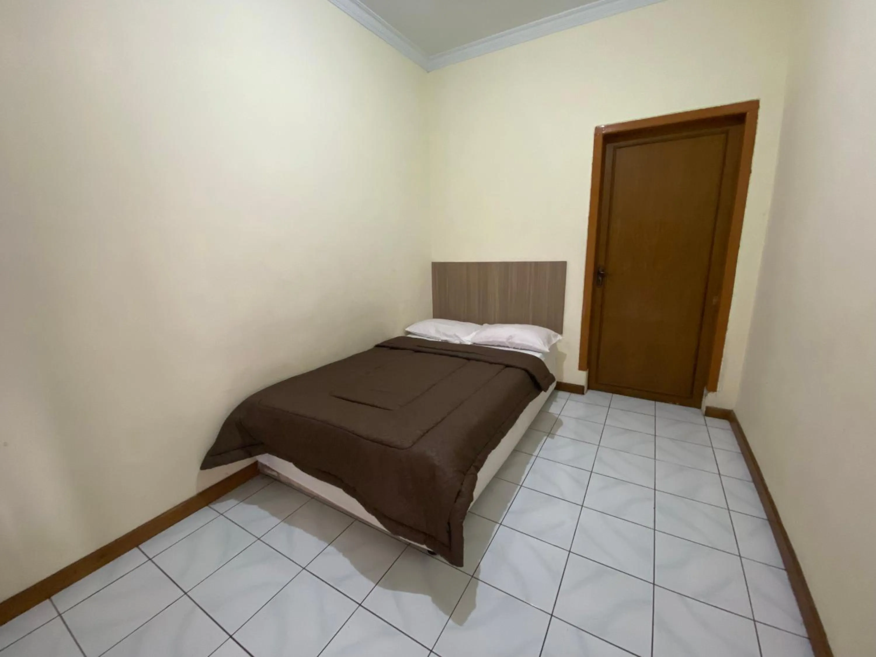 Bed in Hotel Puspa Sari