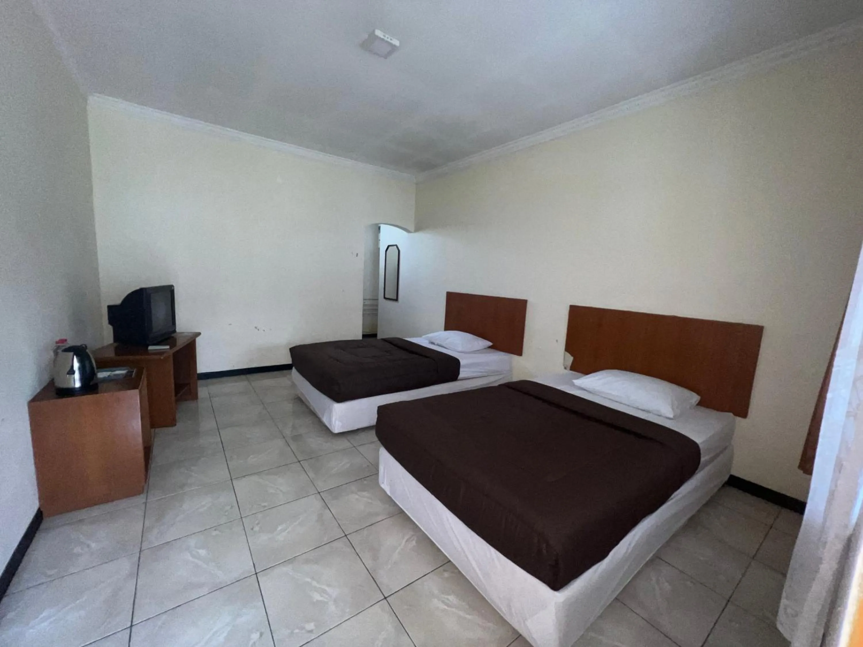 Bed in Hotel Puspa Sari